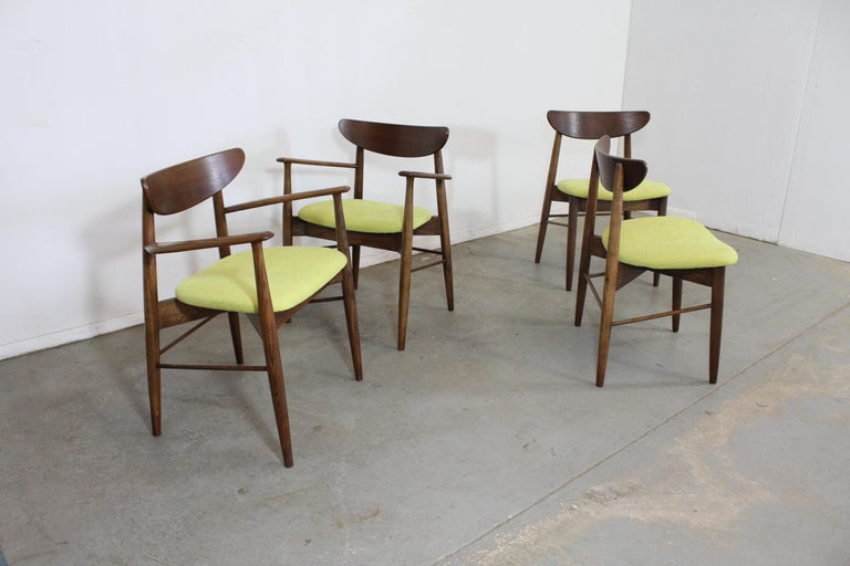 Set of 4 Mid-Century Modern H Paul Browning shell back walnut dining chairs.

Offered is a vintage set of 4 Mid-Century Modern dining chairs attributed to H Paul Browning. These chairs have sleek lines and a lot of potential. Featuring curved