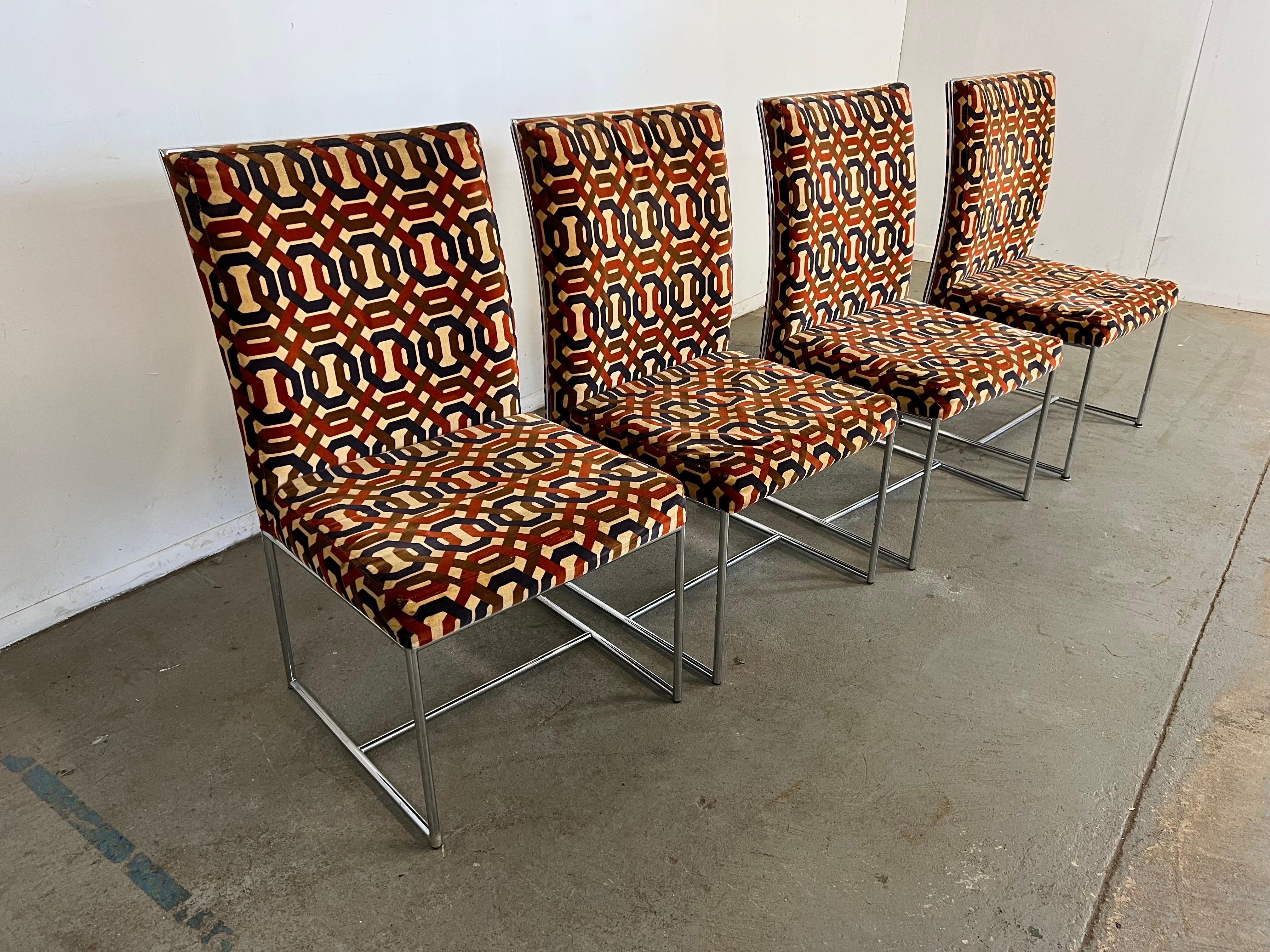 Offered is a vintage set of 4 Mid-Century Modern dining chairs by Milo Baughman for Thayer Coggin. These beautiful chairs have chrome framed bases and original Velvet geometric upholstery. The Chrome is tublular. These chairs make a statement and