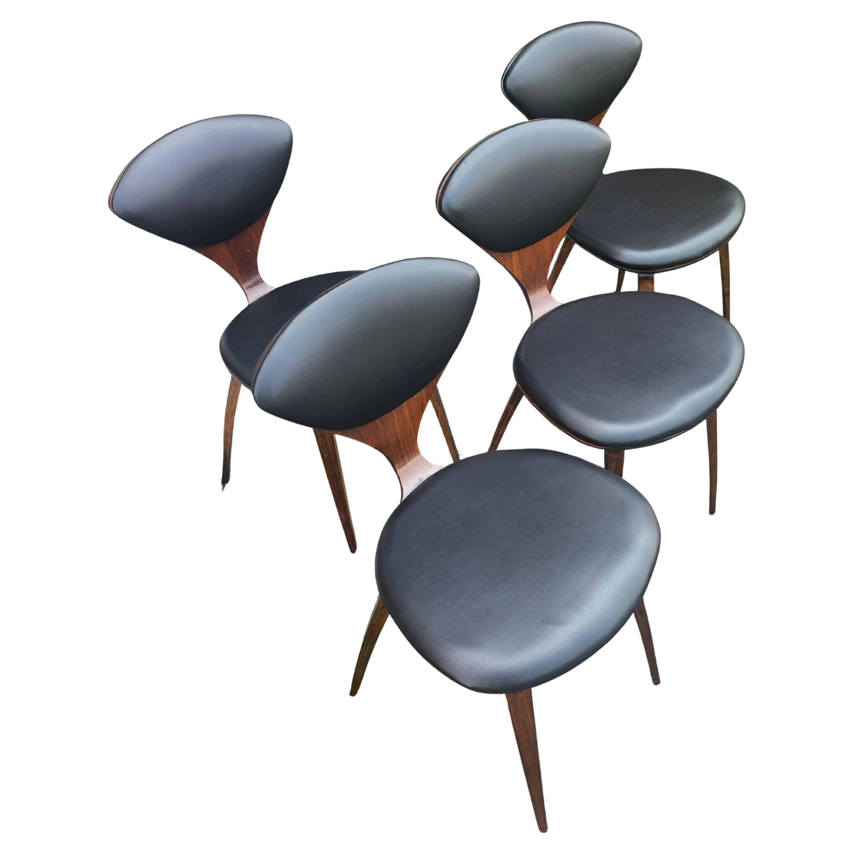 Spectacular design, iconic, from the fifties by Norman Cherner for Plycraft 
Created from walnut plys, bent, steam molded with slightly flexing backs for comfort
Chairs have been refinished and recovered with black vinyl which is excellent 
Please