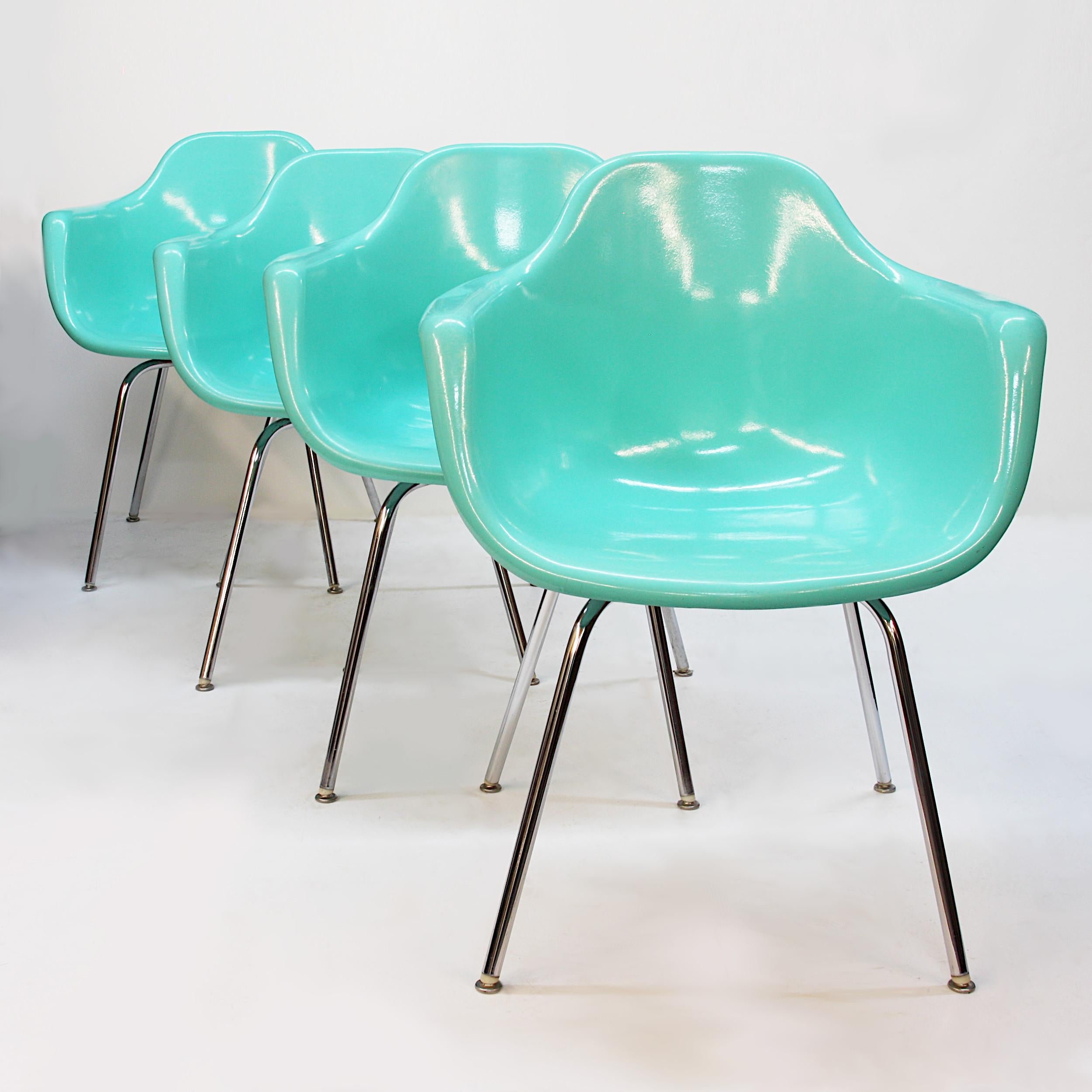 Amazing set of 4 matching fiberglass shell chairs by Krueger Metal Products of Green Bay, Wisconsin. Chairs feature wonderful seafoam green fiberglass shells, chrome bases, and are a great alternative to the Eames/Herman Miller shells! Remarkably