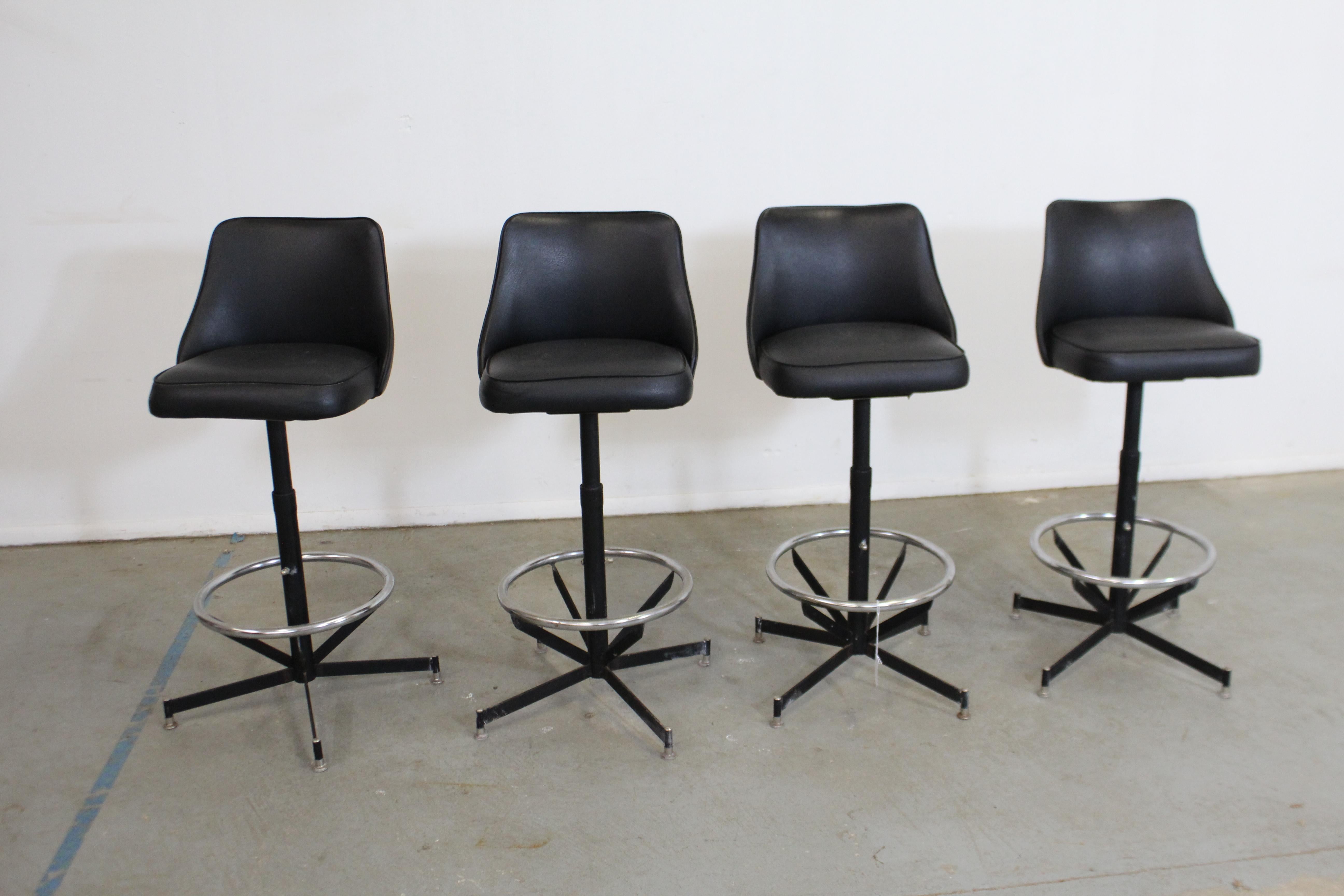 Set of 4 midcentury Danish modern swivel bar stools 

Offered is a great set of 4 Mid-Century Modern swivel bar stools. These stools swivel and feature black bases. They are in good condition for their age, showing some wear (age wear,chrome