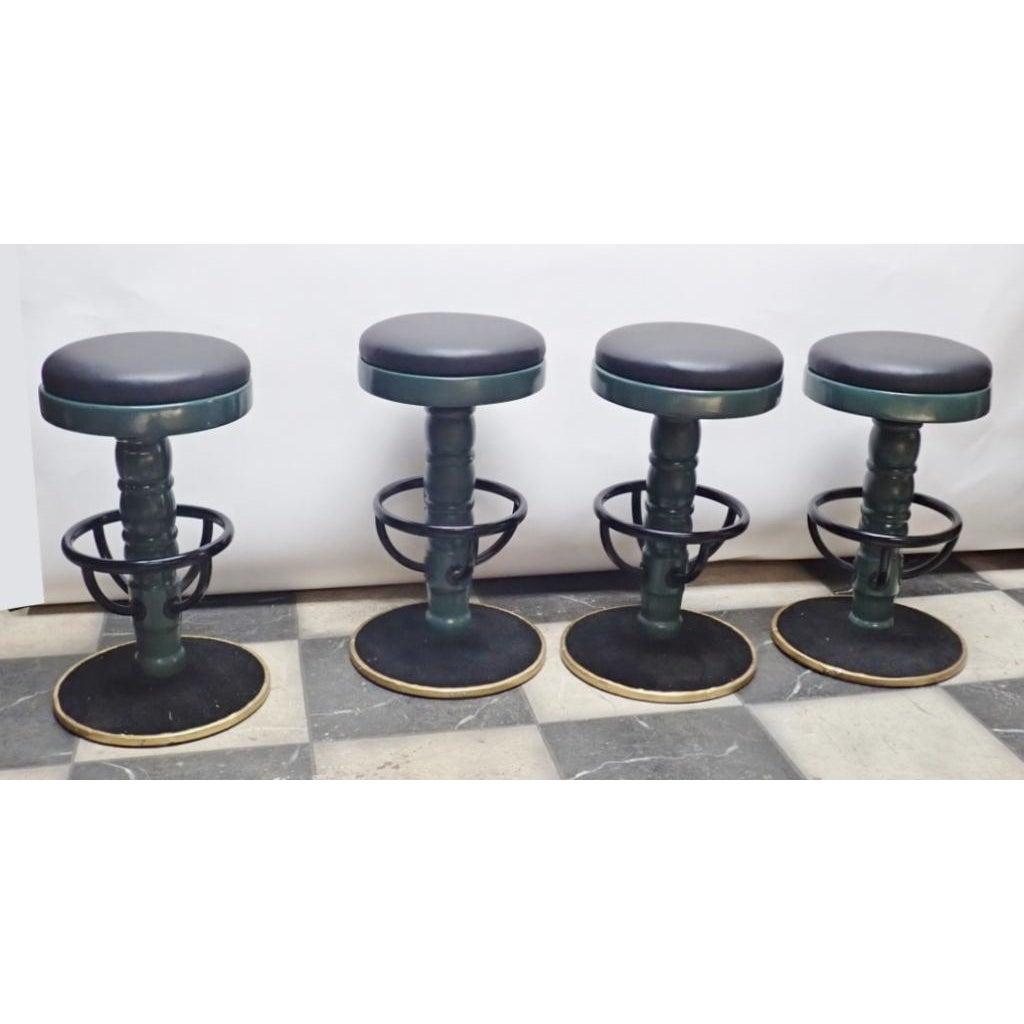 Set of 4 Mid-Century Modern Swivel Bar Stools  Set of four uniquely designed Mid-Century modern swivel bar stools with green painted wooden center pedestal.

Green leather, black painted tubular steel foot rests and circular black felt lined bases