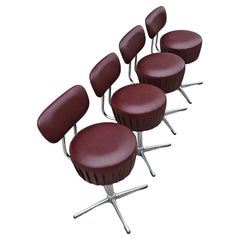 Set di 4 sedie girevoli moderne del Mid Century in acciaio tubolare e pelle