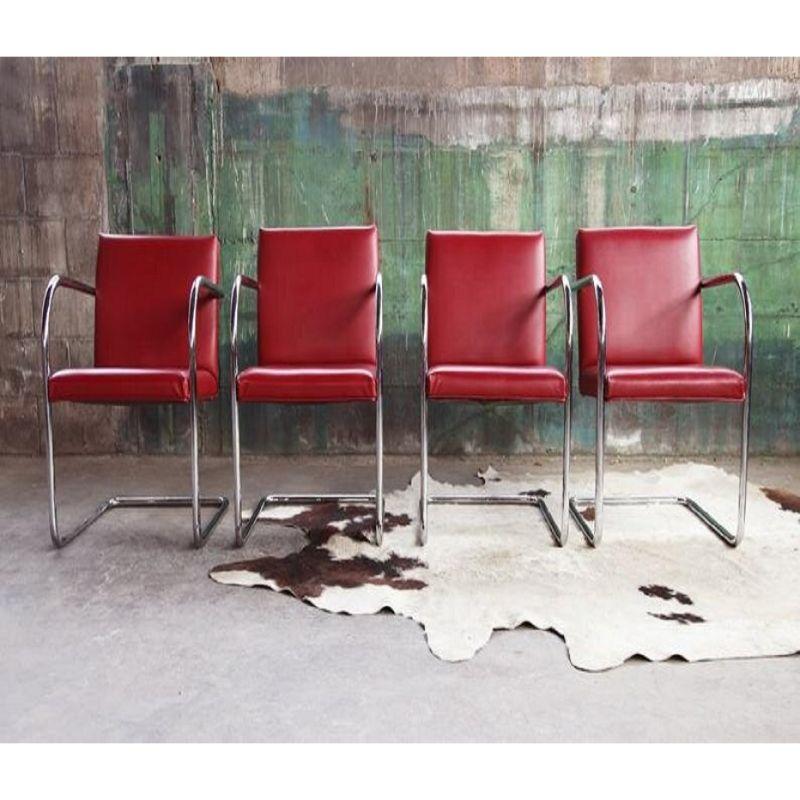 Set of 4 awesome Mies van der Rohe style Brno chairs made by Thonet, in a fantastic bold red! Clean, Modern & Sculptural lines are shown through this classic and collectible early Chrome Cantilever frame.

Top notch polished chrome-plated tubular