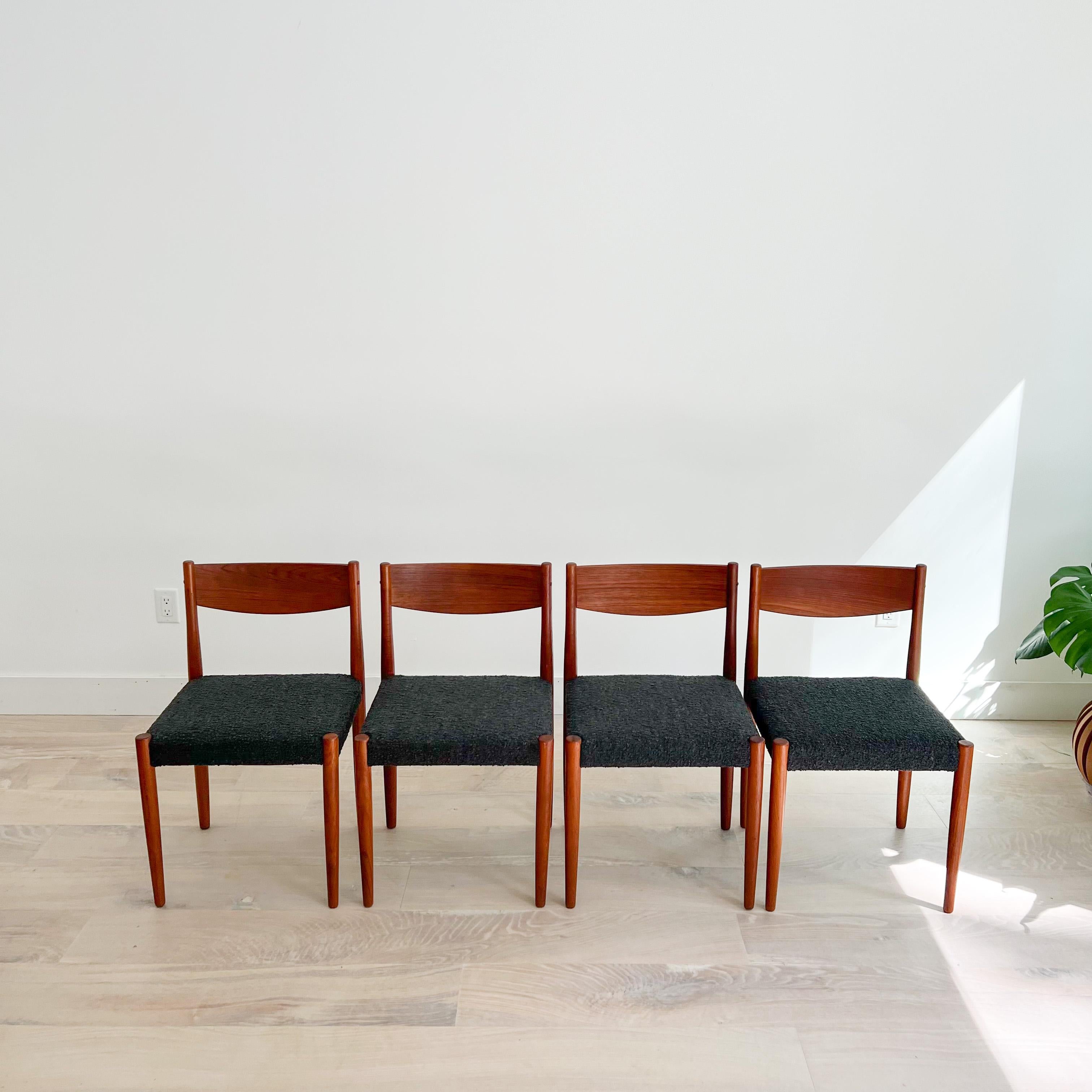 Mid-Century Modern dining chairs designed by Poul Volther for Frem Rojle, Denmark circa 1960's. Features a curved backrest support and pencil tapered legs in teak. This set includes four side chairs that have been newly reupholstered in a charcoal
