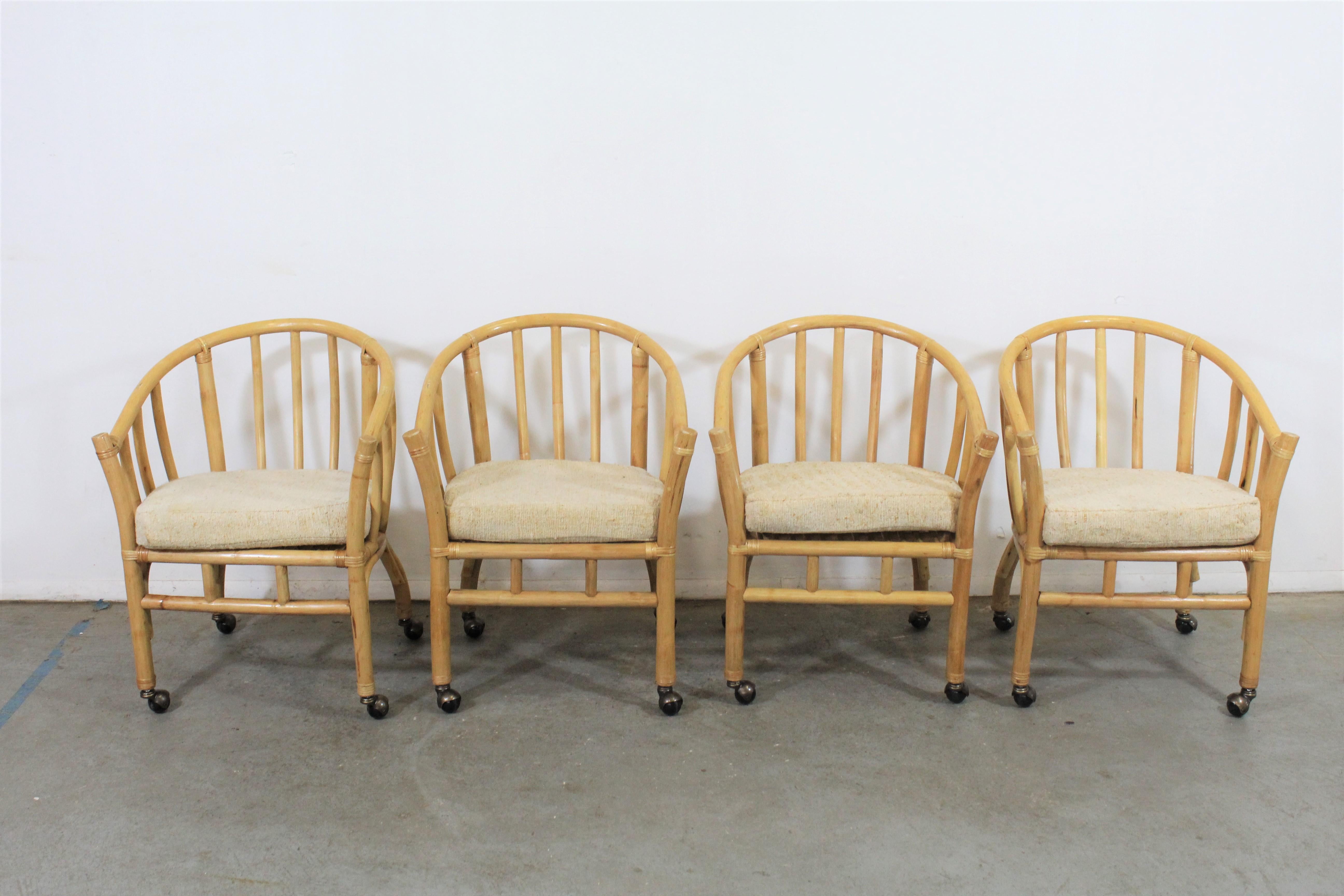 Set of 4 midcentury rattan dining chairs with rollers

Offered is a vintage set of 4 Mid-Century Modern rattan dining chairs. This set has removable cushions and could make an excellent addition to any home. They are in good vintage condition.