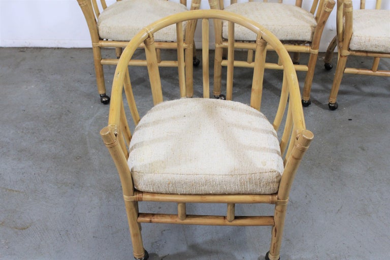 Set of 4 Midcentury Rattan Dining Chairs with Rollers For Sale at