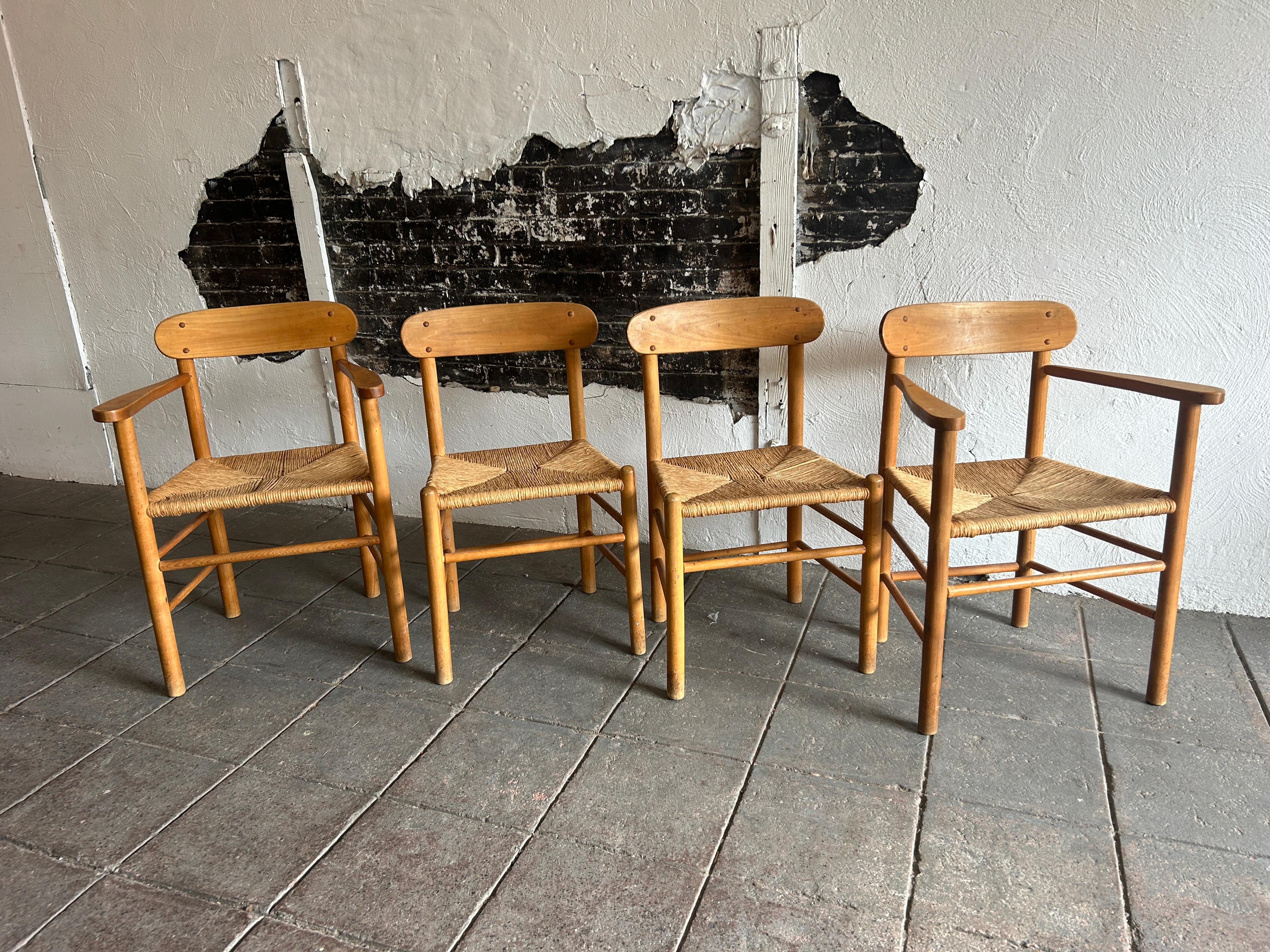 Set of 4 Mid century early J39 Shaker dining chairs. Solid wood frames with woven paper cord upholstery. Scandinavian modern design with simple lines. Great set of (4) dining chairs (2) arm chairs and (2) side chairs. Ready for use. Great minimalist