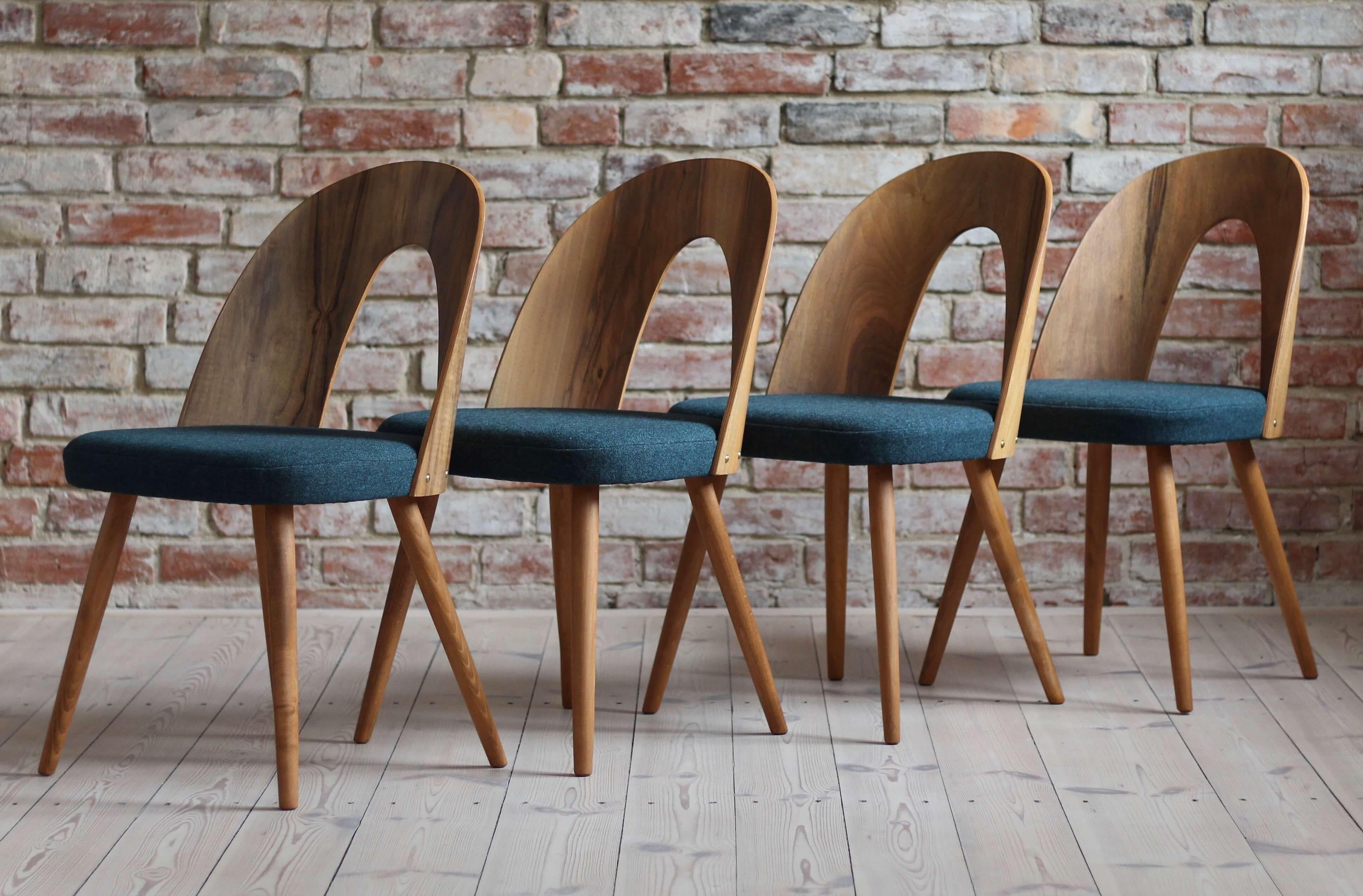 This set of four vintage dining chairs was designed by Czech designer Antonin Šuman in the 1960s. The chairs have been completely restored finished with high-quality oil that gave them beautiful and natural finish. The set is reupholstered with