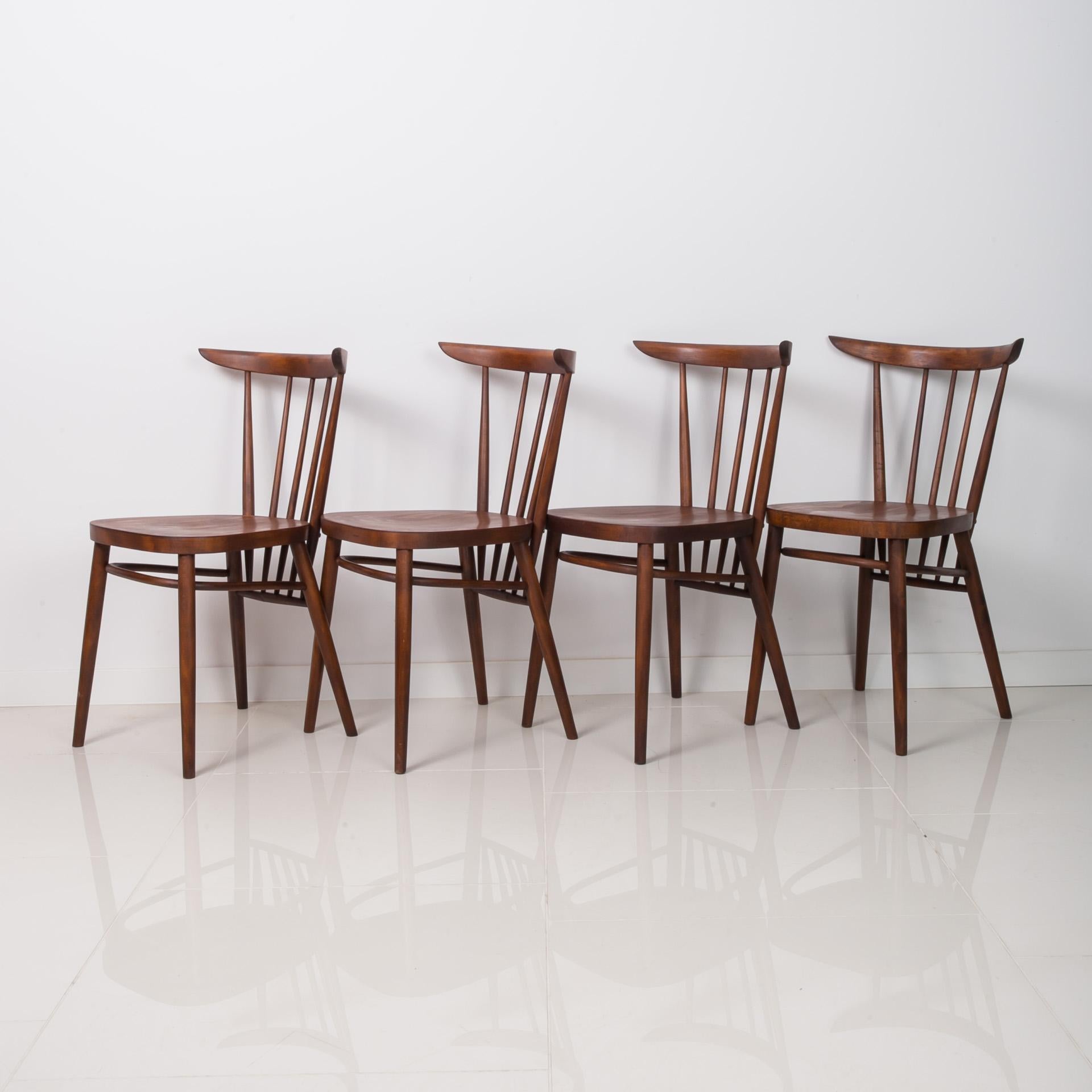This set of four vintage dining chairs was designed by Czech designer František Jirak in the 1960s and produced by Tatra Nabytok. They are made of beech wood. The chairs have been completely restored finished with high-quality oil that gave them