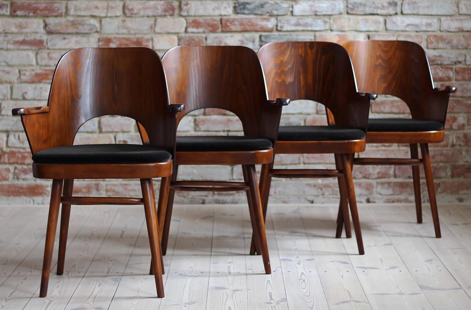 This set of four vintage dining chairs was designed by Lubomir Hofmann around 1950s, famous Czech designer who was closely associated with the Thonet brand. The chairs have been completely restored finished with high-quality lacquer that protects
