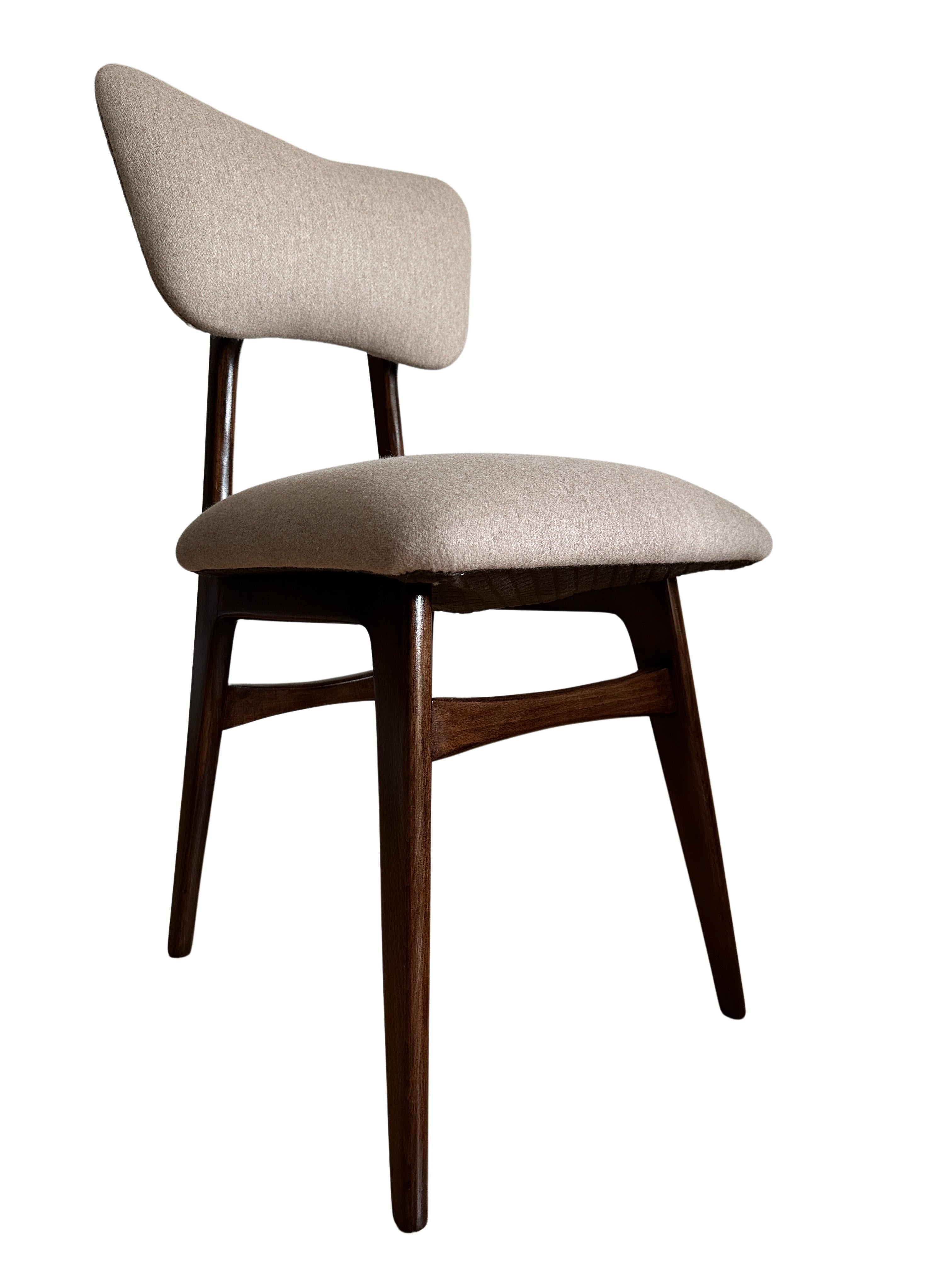 Unique set of four chairs manufactured in Poland in the 1960s, designed by Rajmund Halas. 

The upholstery is made of premium wool fabric, nice and soft to the touch. 
A noble, thick woollen fabric recommended for upholstery, but also suitable for