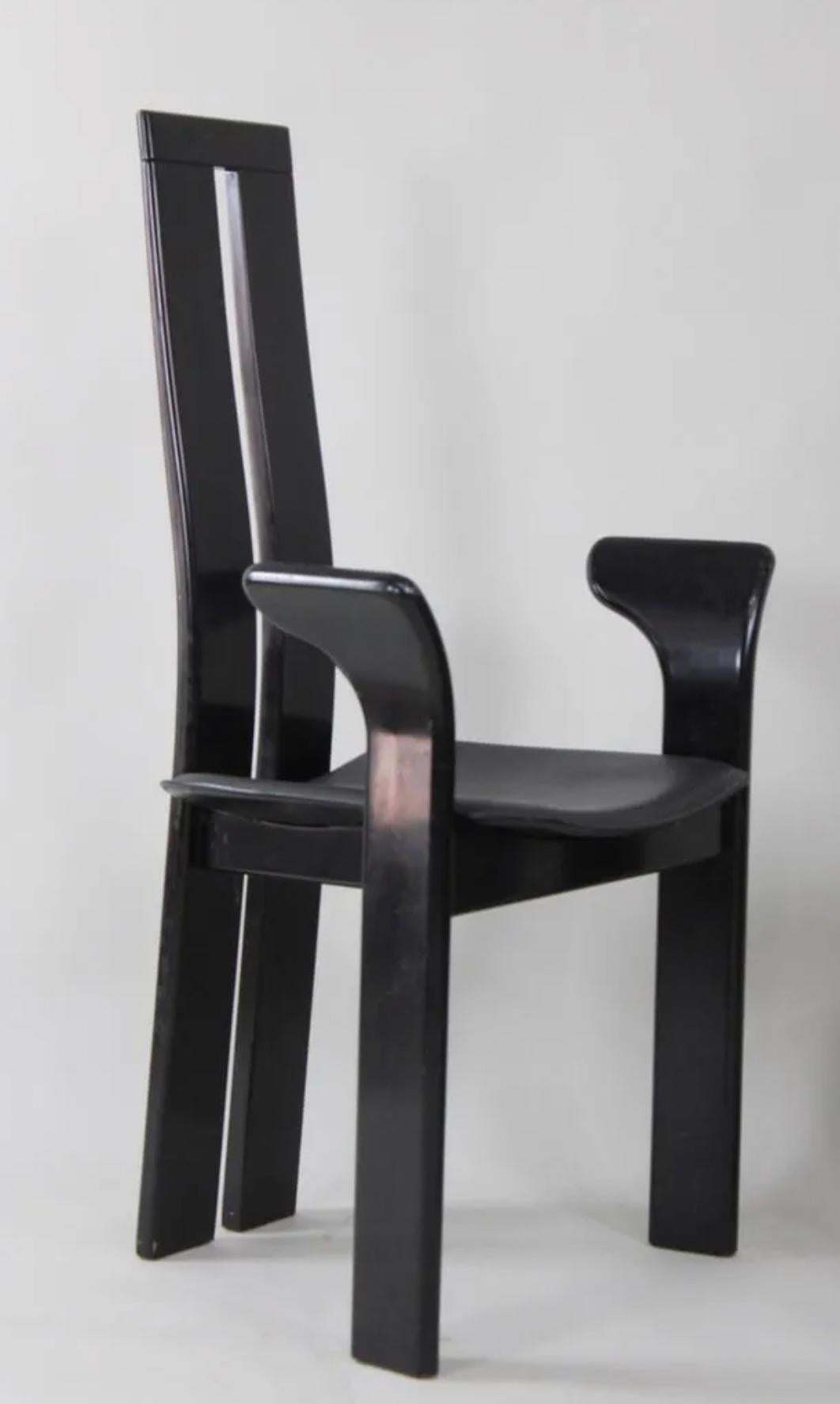 Amazing Set of 4 midcentury Post Modern Dining Chairs by Italian Designer Pietro Costantini. Very delicate Post Modern Designed Black Lacquer dining chairs with upholstered Seats. All chairs are ready for use. show normal wear from use. Made in