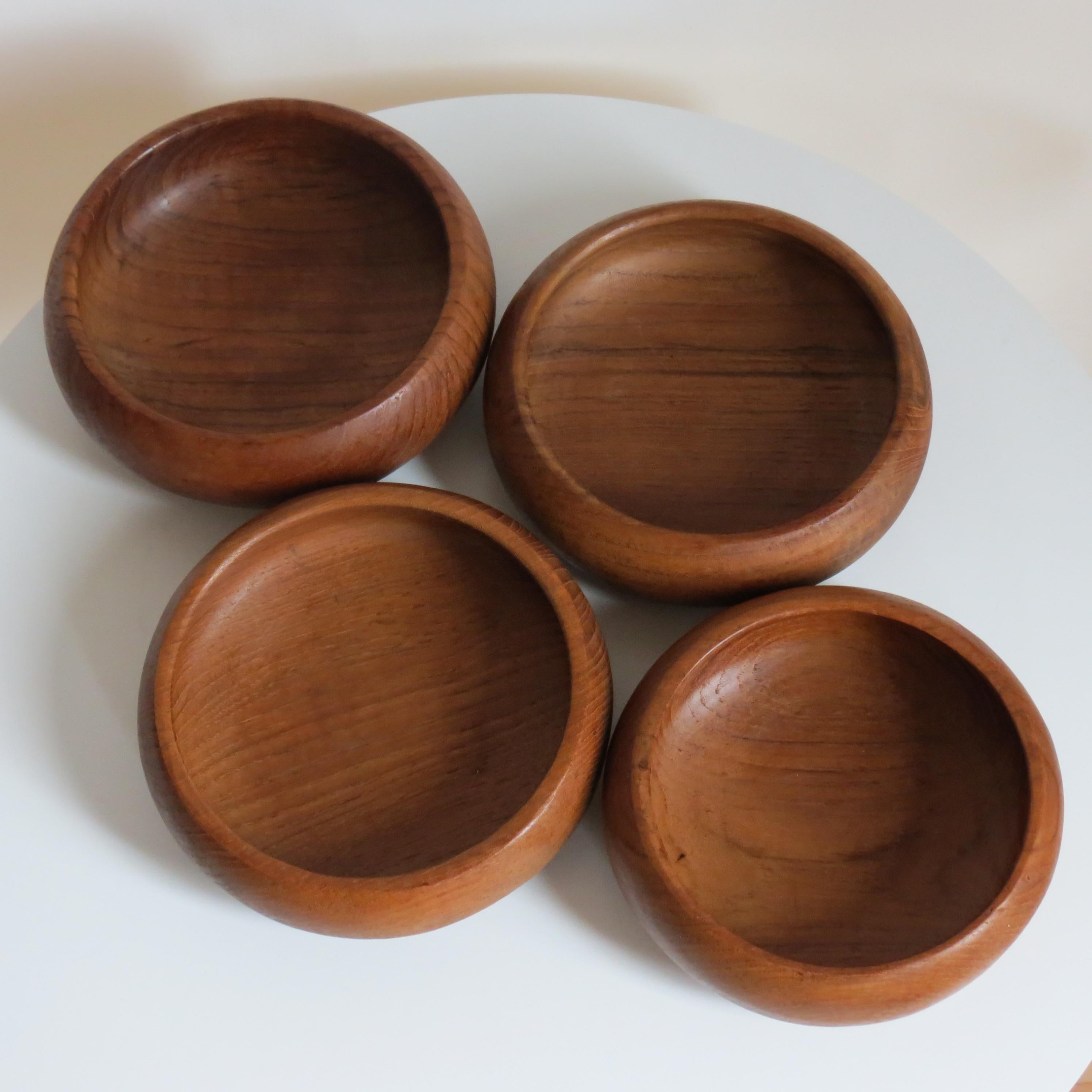 Wonderful set of 4 hand crafted Teak bowls.  Each bowl has been hand produced and they vary slightly in size.  Date from the 1960s. 
In good overall condition, minimal sizes of wear and use
Ideal snack bowls.
Please note the price for shipping to