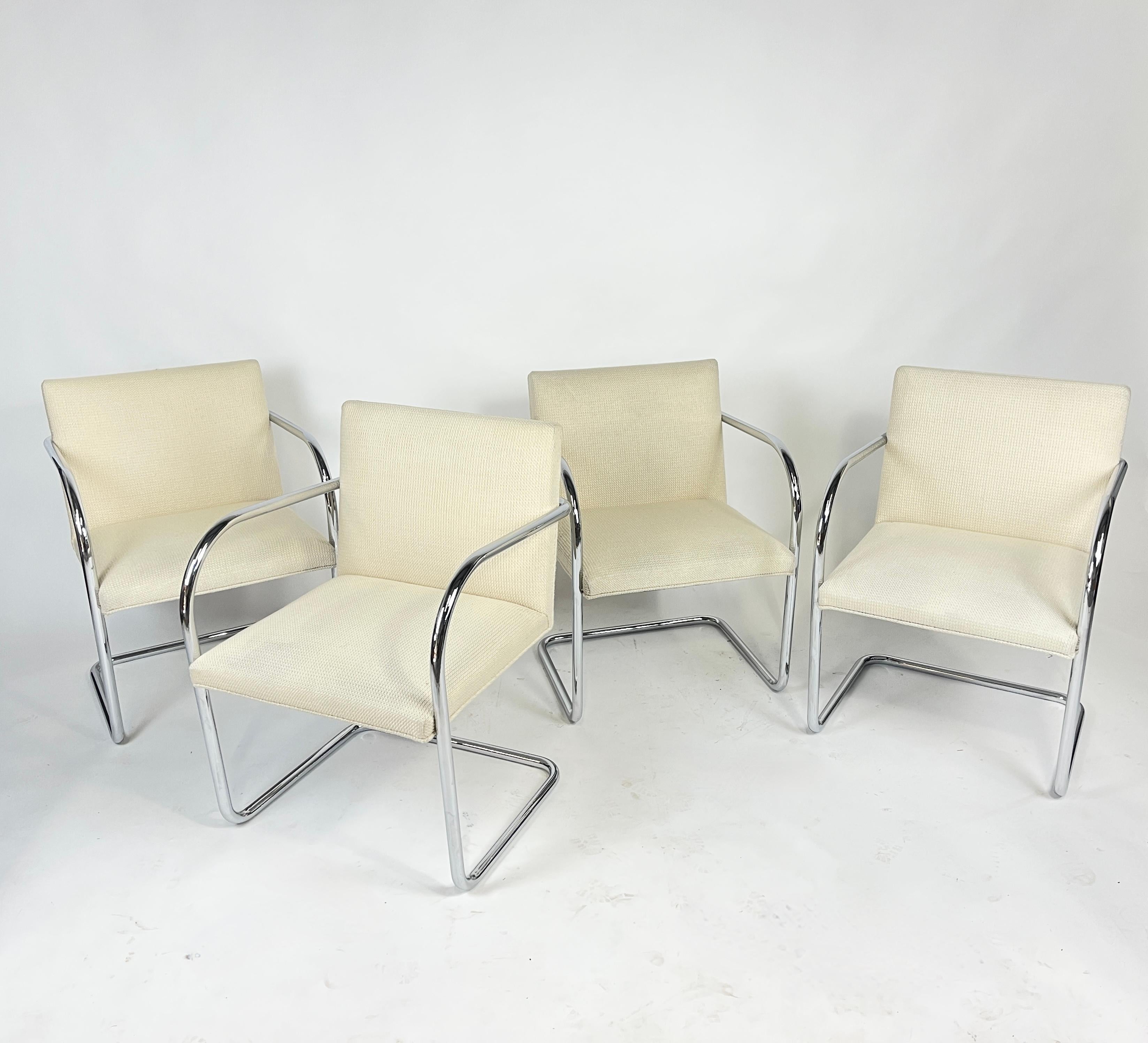 Set of 4 Knoll Brno chairs designed by Mies Van der Rohe. These chairs are upholstered in Knoll's Cato upholstery. Color is 'natural'- which reads as a pale oatmeal color. These chairs are from 2018 so in very nice condition. 

Cato Upholstery in