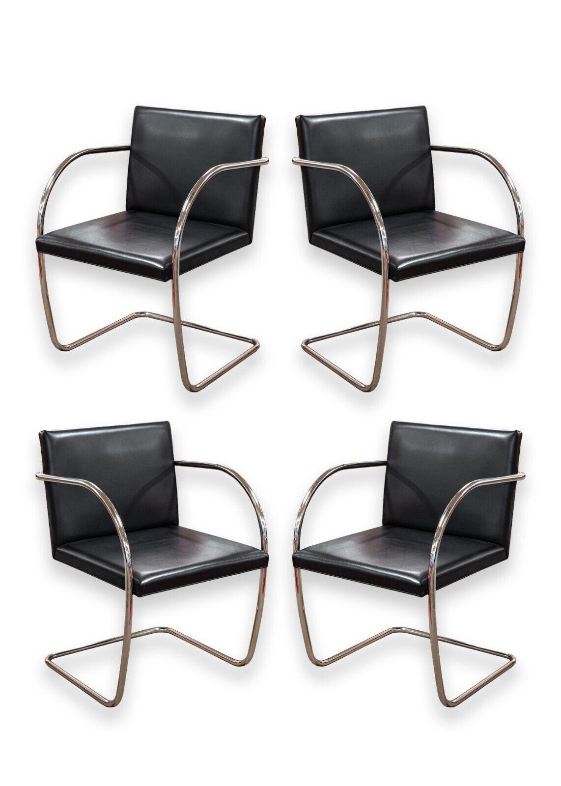 A set of 4 black leather tubular Brno chairs. A beautiful, classic set of chairs from legendary designer Mies van der Rohe for Knoll. These iconic chairs feature a simple rectangular black leather seat and back, and a tubular chrome cantilever