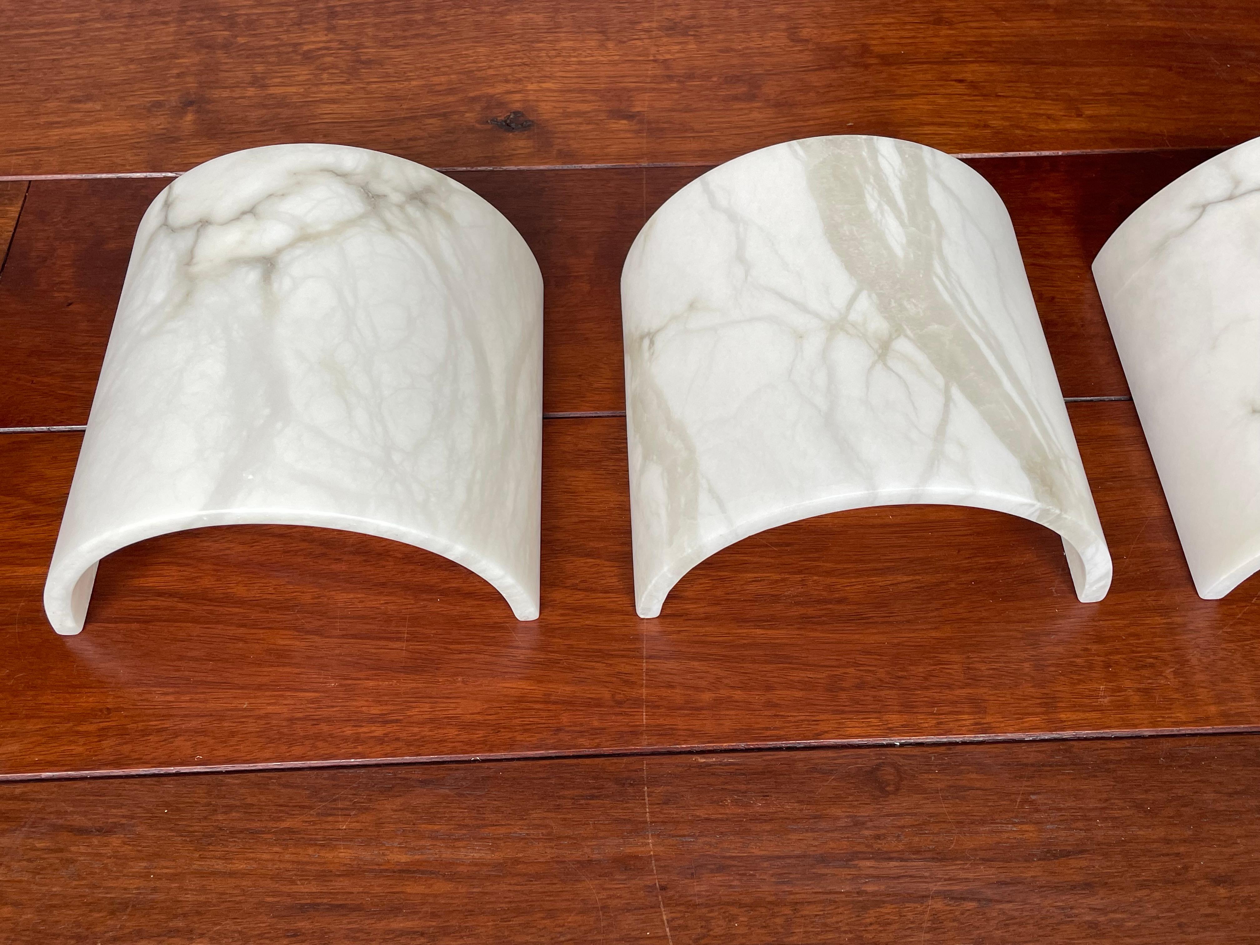 Timeless design and easy to mount alabaster wall sconces from the midcentury era.

If you are looking for a stylish and timeless way to bring atmospheric light into your entry hall, up your stairwell, in your kitchen or bedroom etc then this set of