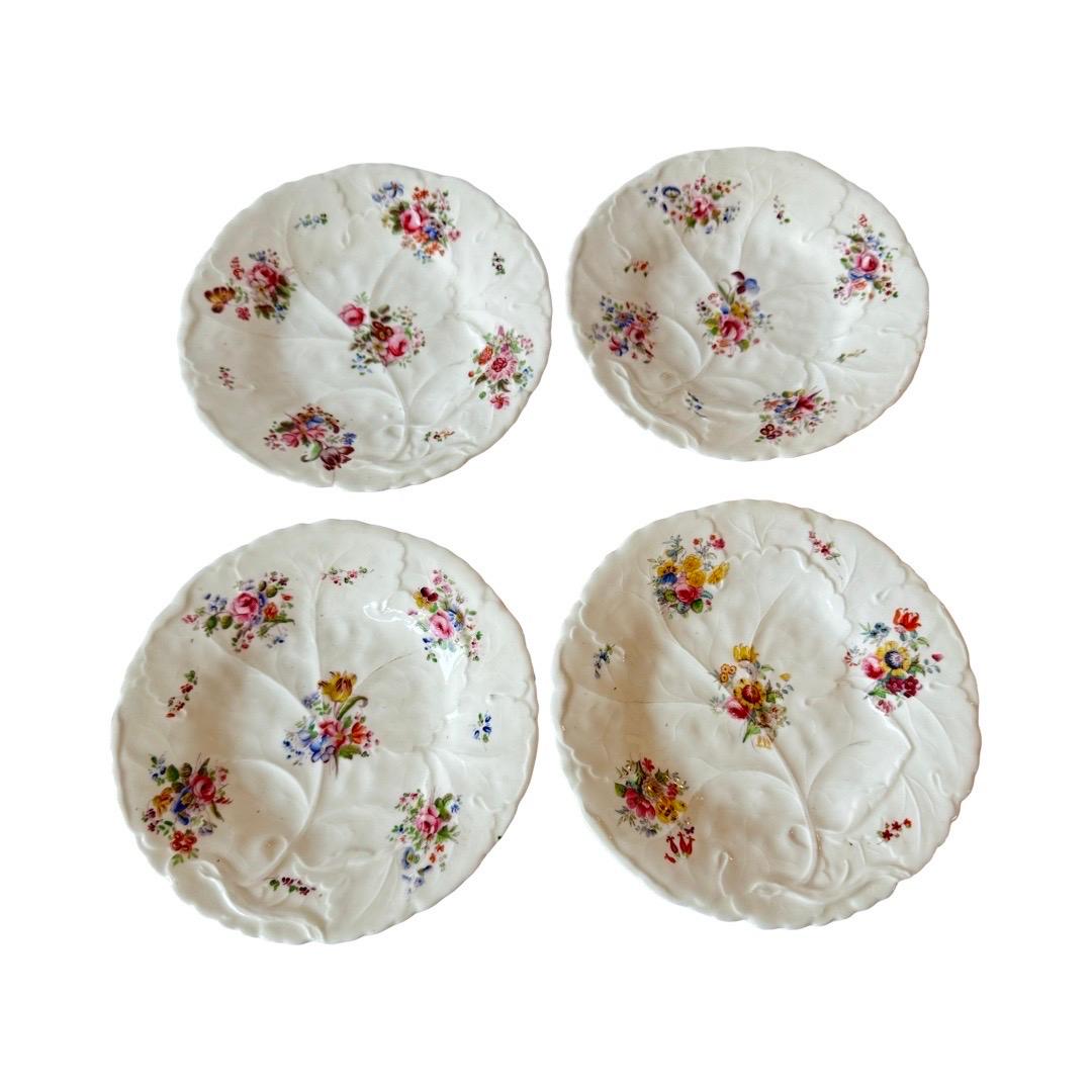 A rare and beautifully preserved set of 4 English porcelain dessert plates, attributed to Minton & Boyle, Staffordshire, circa 1836–1841. These early 19th-century pieces represent the refined elegance of the Rococo Revival era in British