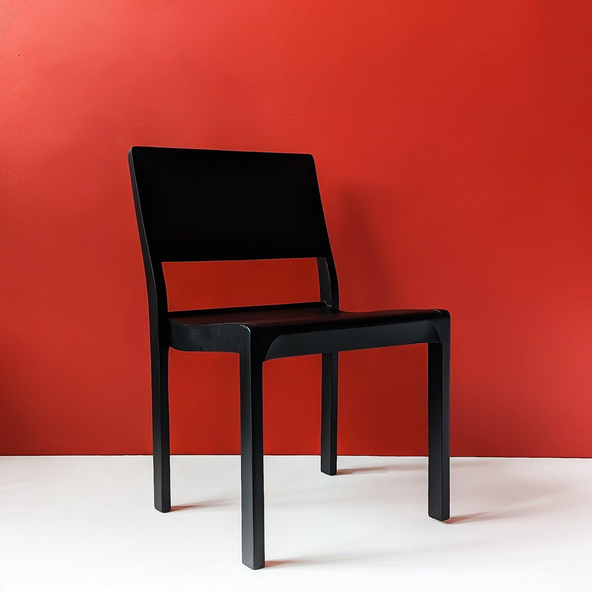 Chair 611 , designed by Alvar Aalto in 1929, is a stacking auditorium chair made of solid birch, also known as the 
