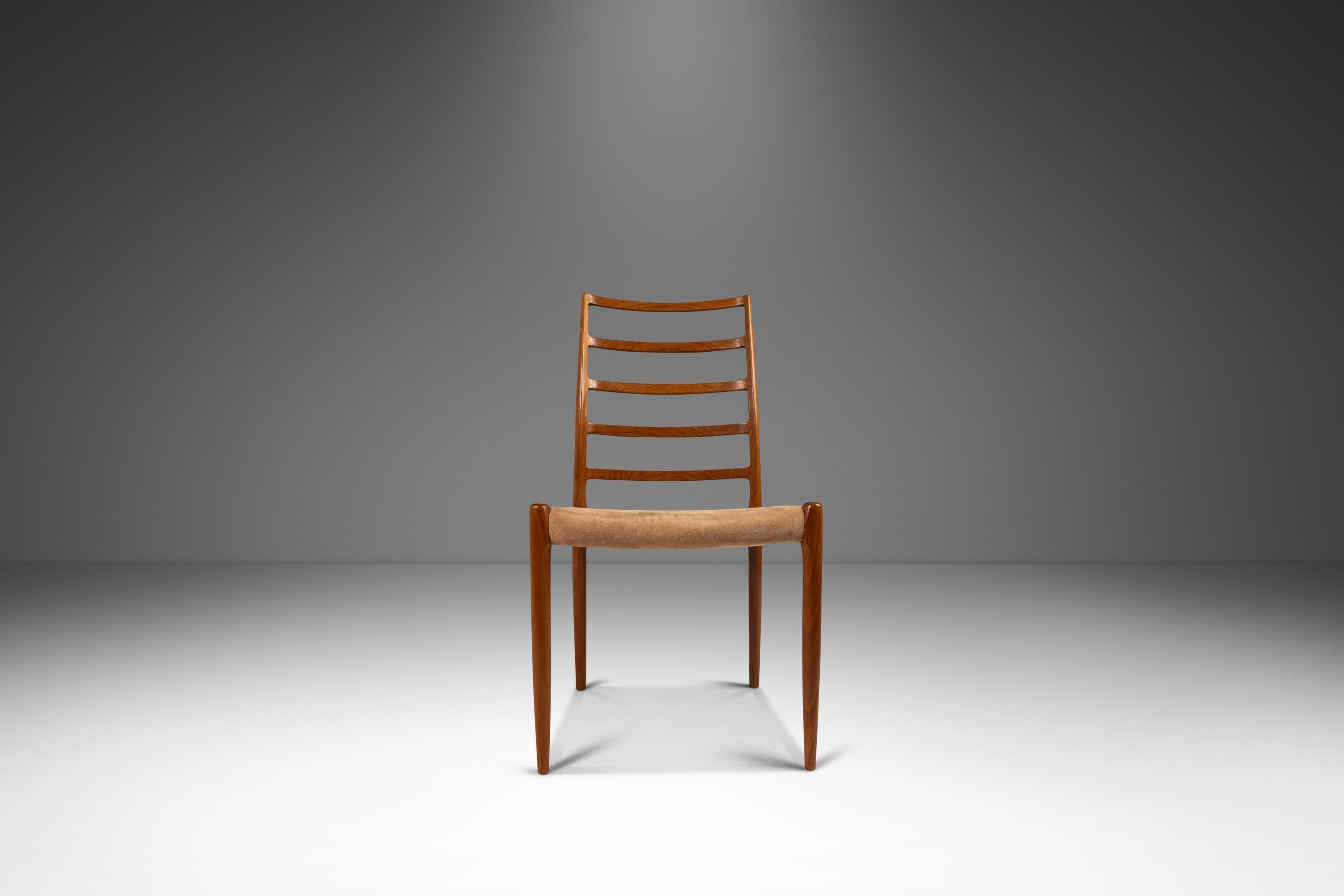 Introducing a rare and limited set of four (4) Model 82 ladderback dining chairs designed by Niels Møller for J.L. Møllers Møbelfabrik, crafted in the 1970s in Denmark. These stunning chairs are constructed from solid teak, showcasing the natural