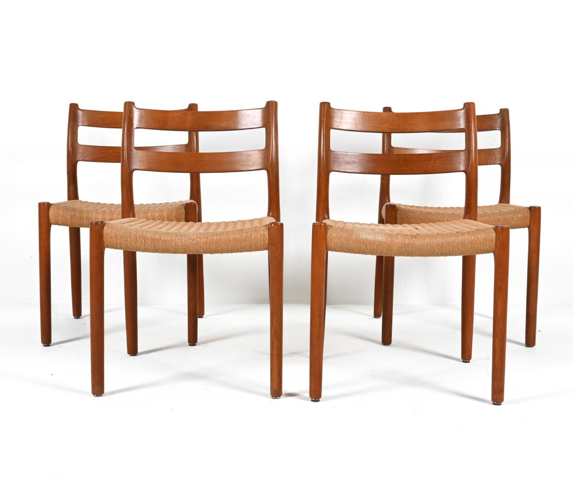 Indulge in the rare beauty of fine craftsmanship with this exceptional set of (4) Model 84 dining side chairs, designed by Niels Otto Møller and produced by his firm J.L. Møllers Møbelfabrik in the 1960's-1970's. 

Unlike many designers of the
