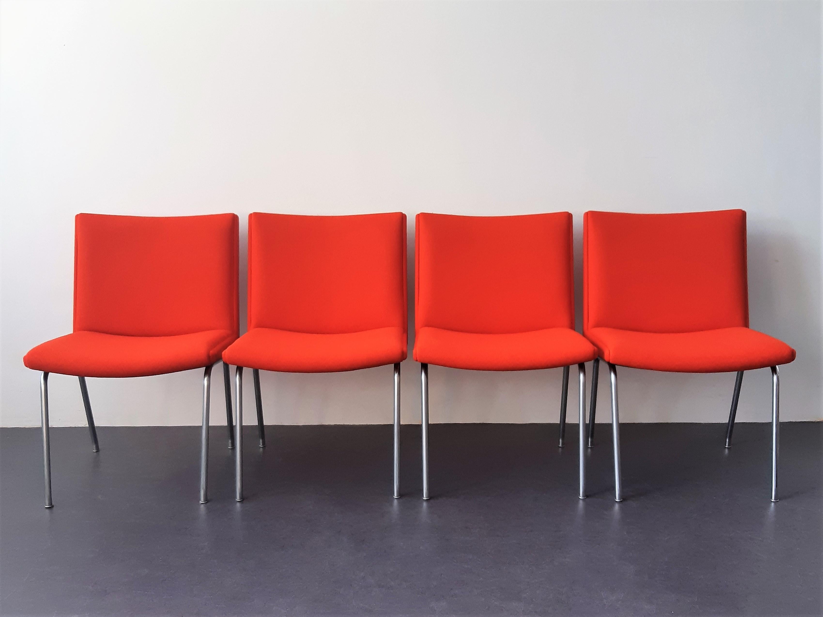 The Airport chair, model AP40, is a design from 1959 by Hans J. Wegner for the Kastrup Airport in Copenhagen. It was produced by the company AP Stolen. These 4 chairs are completely re-upholstered in a beautiful and high quality red Kvadrat felt