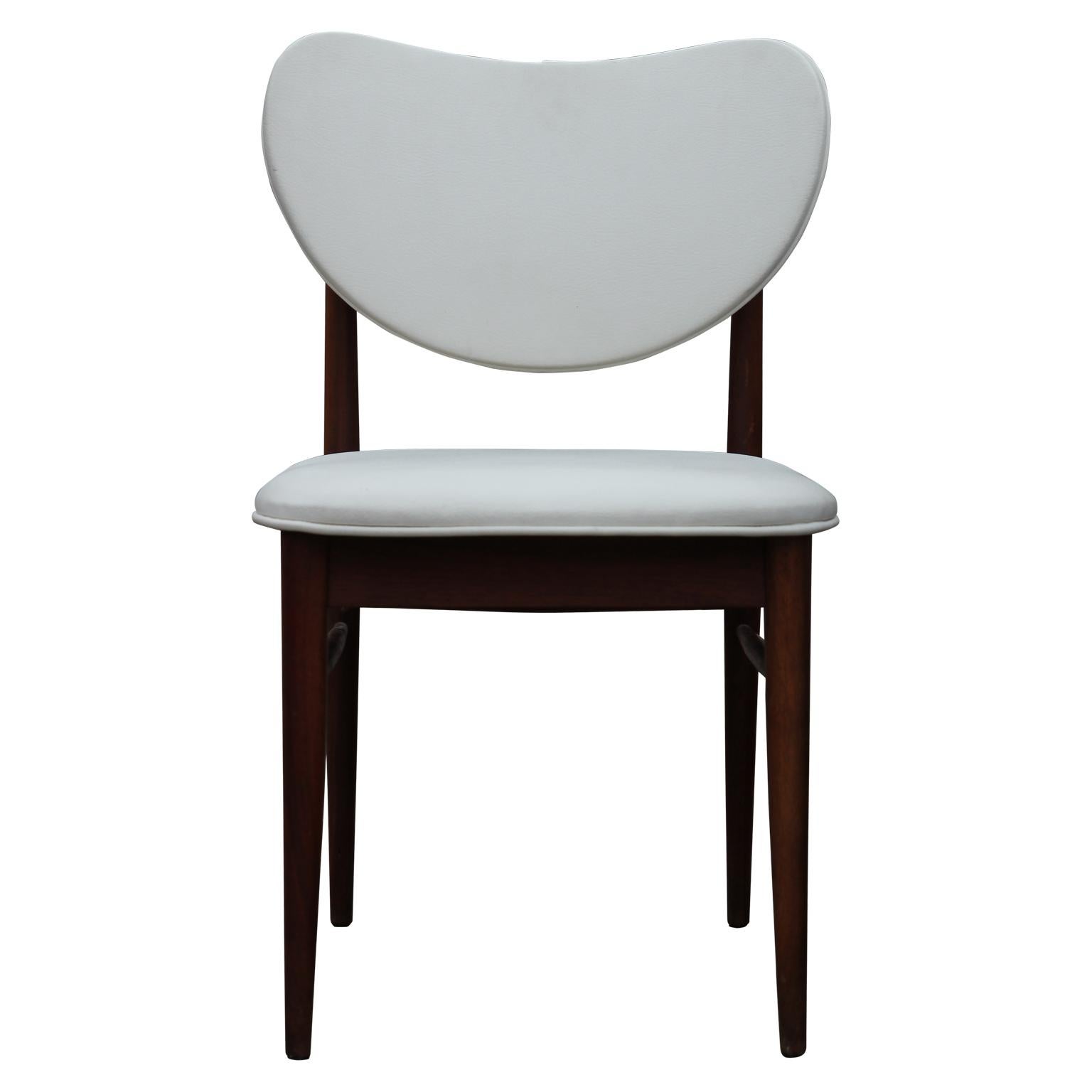 Sleek set of four white leather dining chairs with a teak base. The chairs are in the style of Finn Juhl's furniture designs, 1950s.