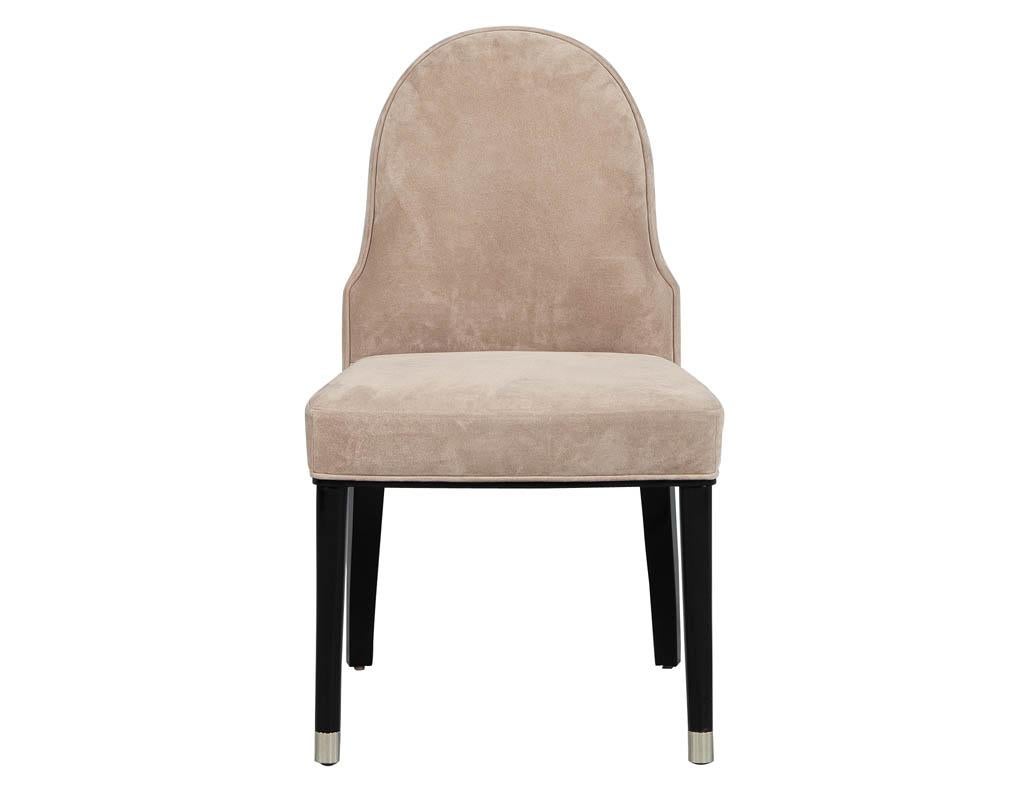 Visually stunning, this accent chair is constructed with a solid mahogany frame. Upholstered in a tight seat and back, finished with gorgeous chrome feet and a dark mahogany finish.