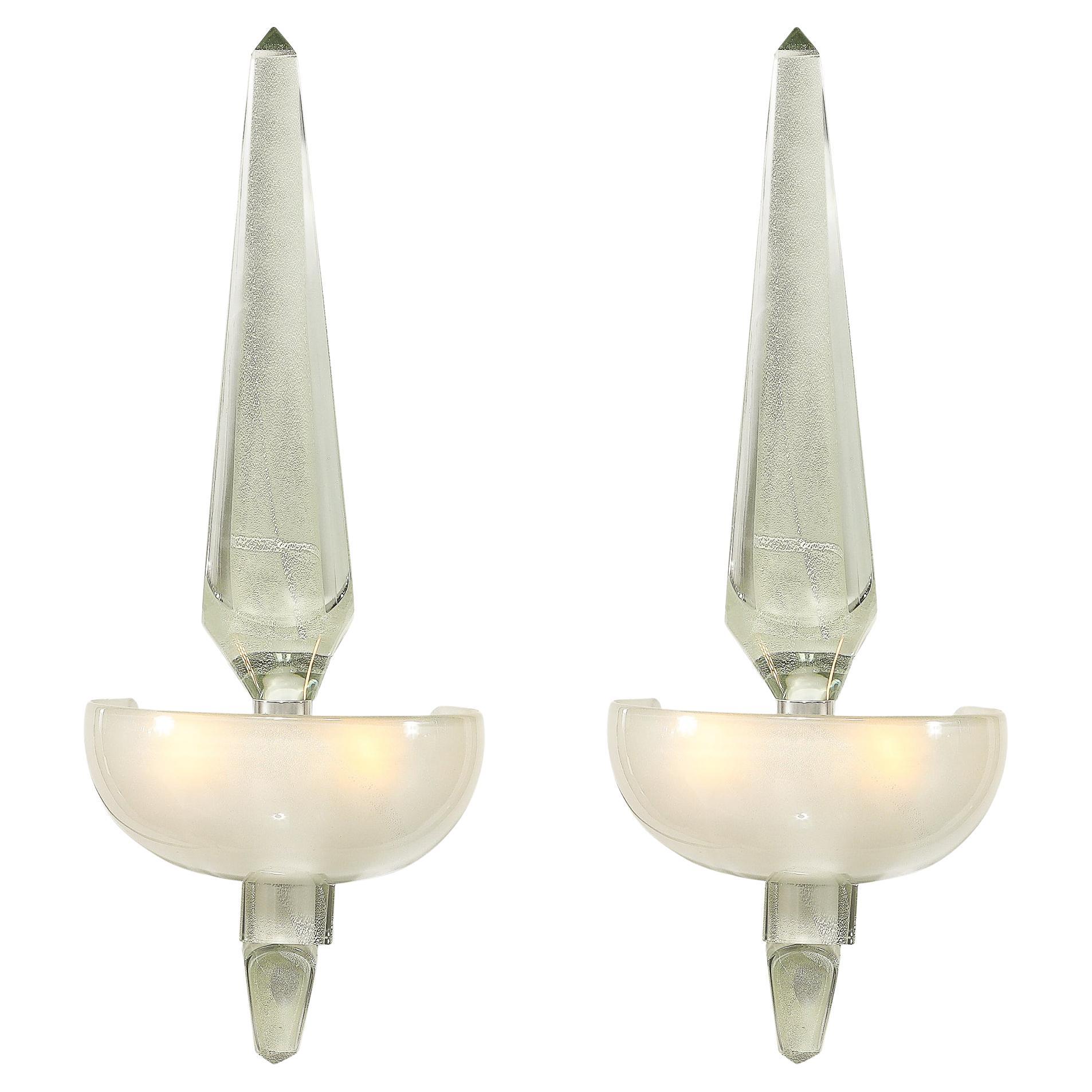 This striking Set of Four Modernist Murano Obelisk Sconces in Pearlescent Glass with 24-Karat White Gold originates from Italy during the 21st Century. Features a primary obelisk in the center of the sconce made of hand-blown Murano Glass with a