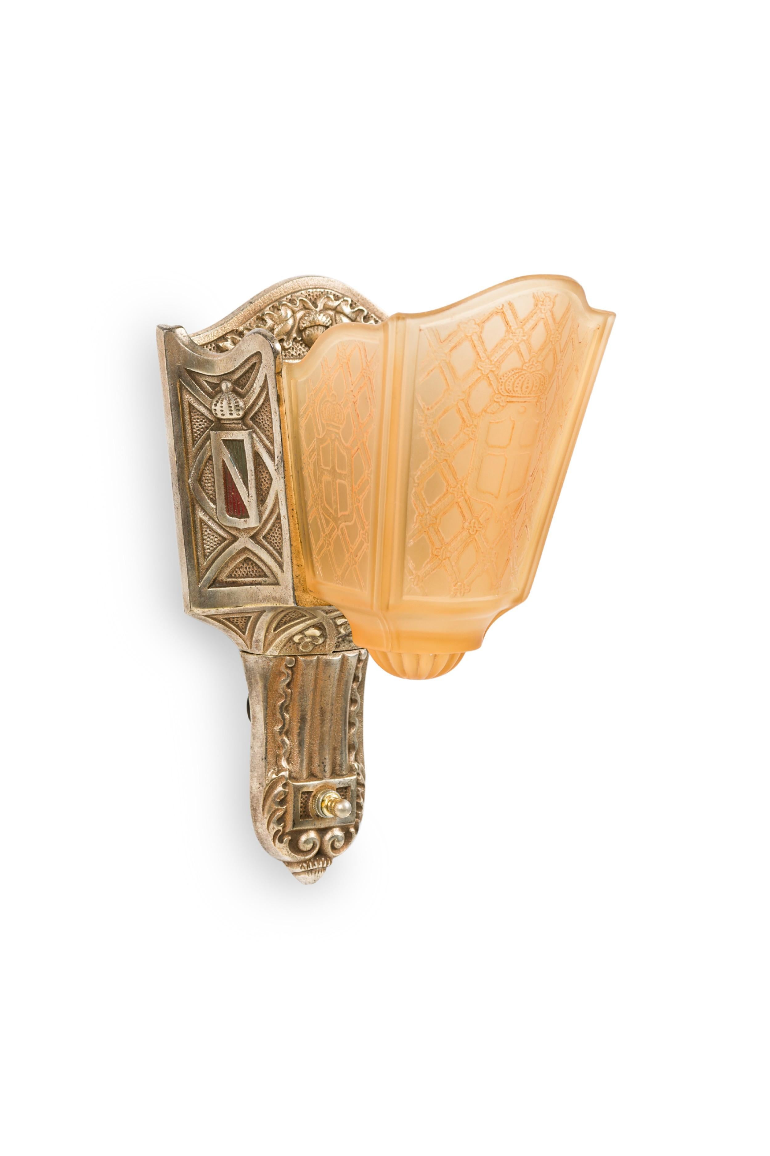 SET of 4 American Art-Deco silvered metal wall sconces with an amber colored shield shaped glass slip shade having a gemetric design (MOE BRIDGES MFG, Milwaukee, WI) (PRICED AS SET)