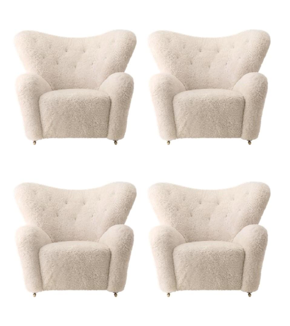 Set of 4 moonlight sheepskin The Tired Man lounge chair by Lassen
Dimensions: W 102 x D 87 x H 88 cm 
Materials: Sheepskin

Flemming Lassen designed the overstuffed easy chair, The Tired Man, for The Copenhagen Cabinetmakers’ Guild Competition