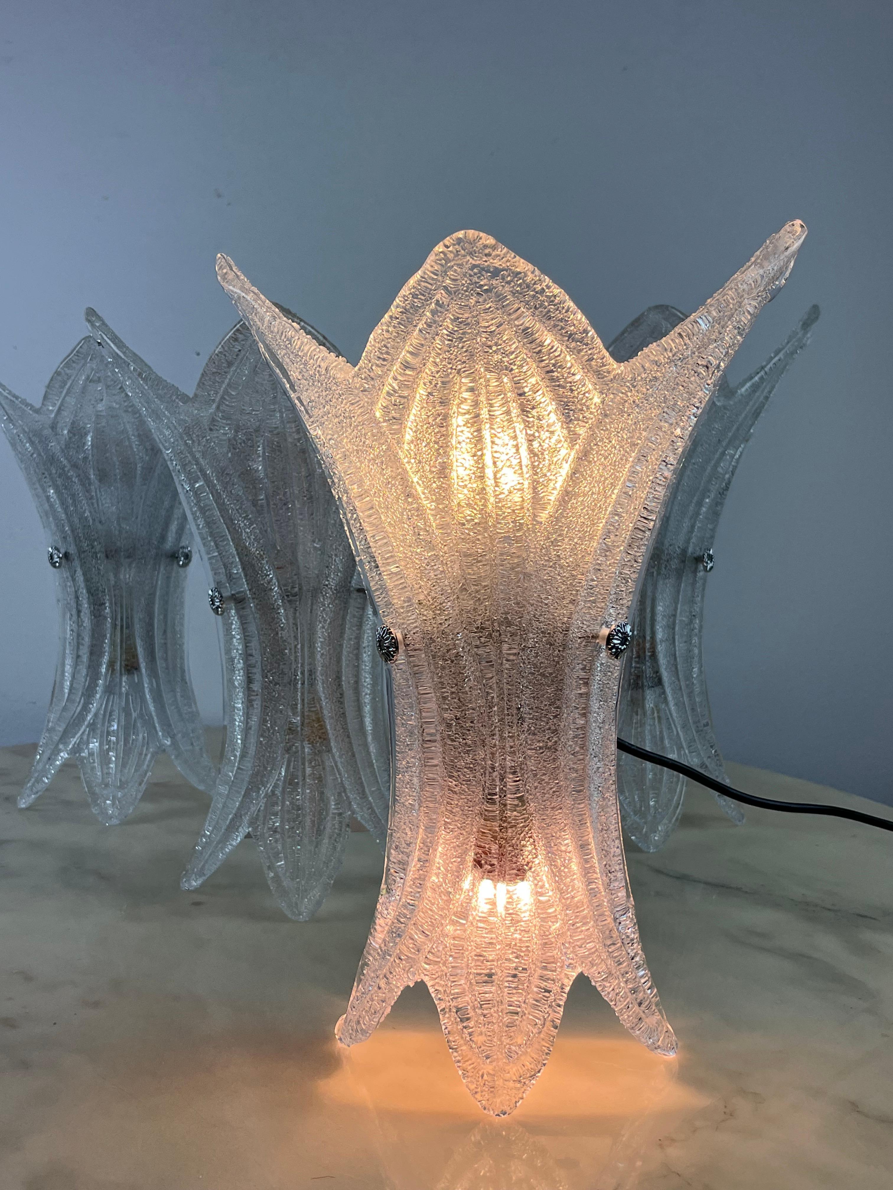 Set of 4 wall lamps with metal structure and transparent and milky Murano glass diffusers. Italy of the 90s. 

Each has double lighting.