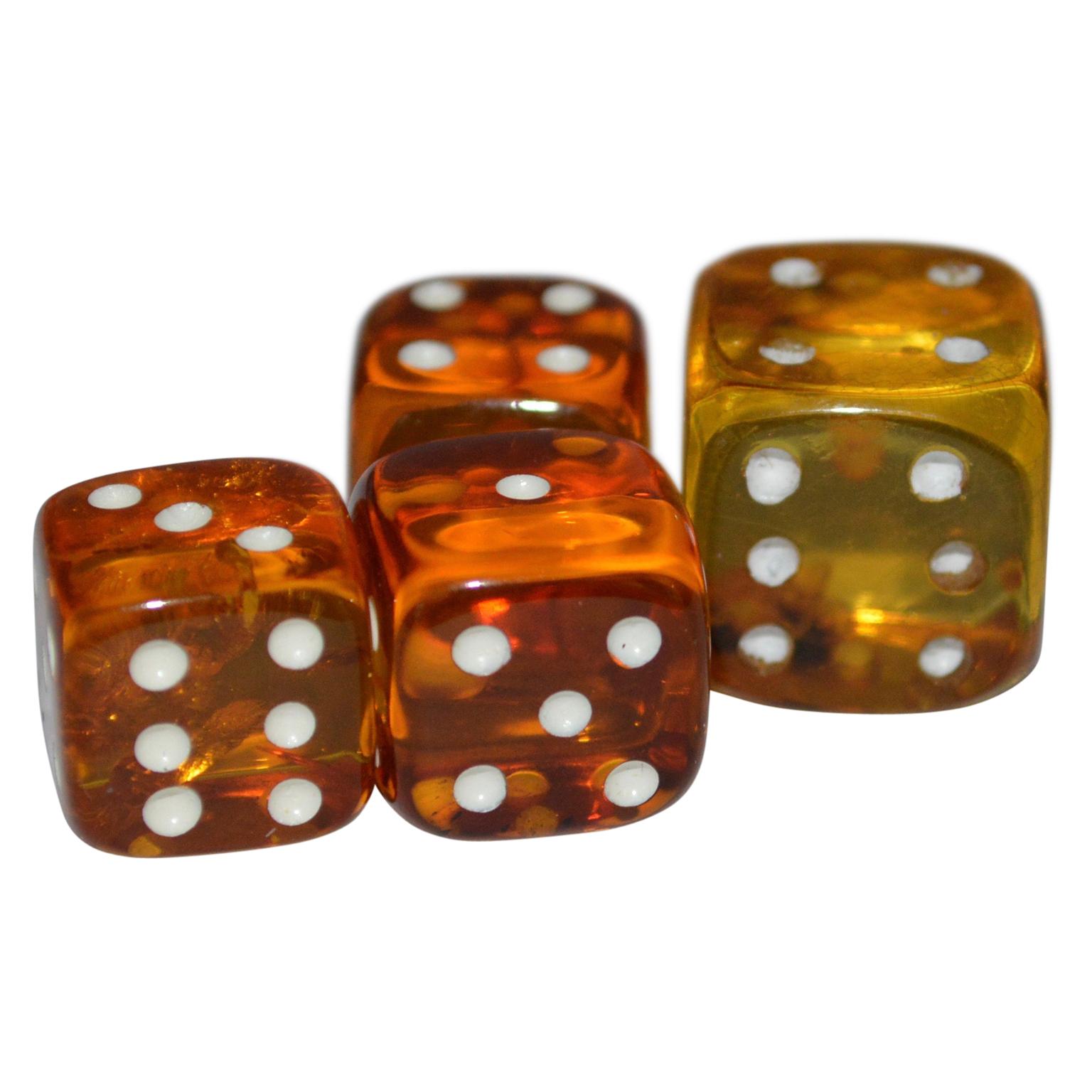 Set of 4 natural amber dice, in different shades of color.