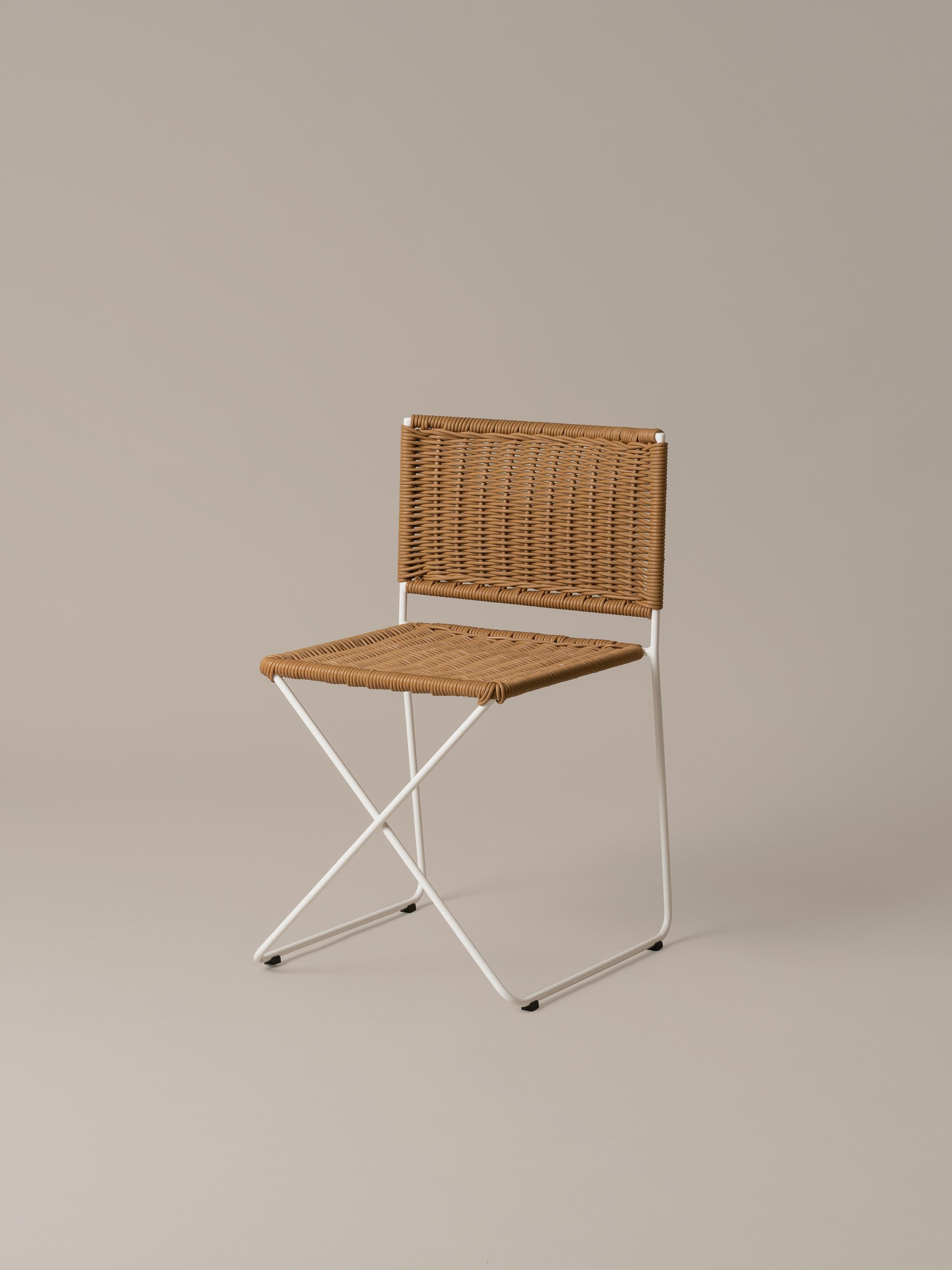 Set of 4 natural Ramón chair by Ramón Bigas
Dimensions: D 45 x W 46 x H 75 cm
Materials: metal, rattan.
Available in white or natural rattan.

The Ramón chair is a carefree yet serious design suitable for both indoor and outdoor use. The white metal