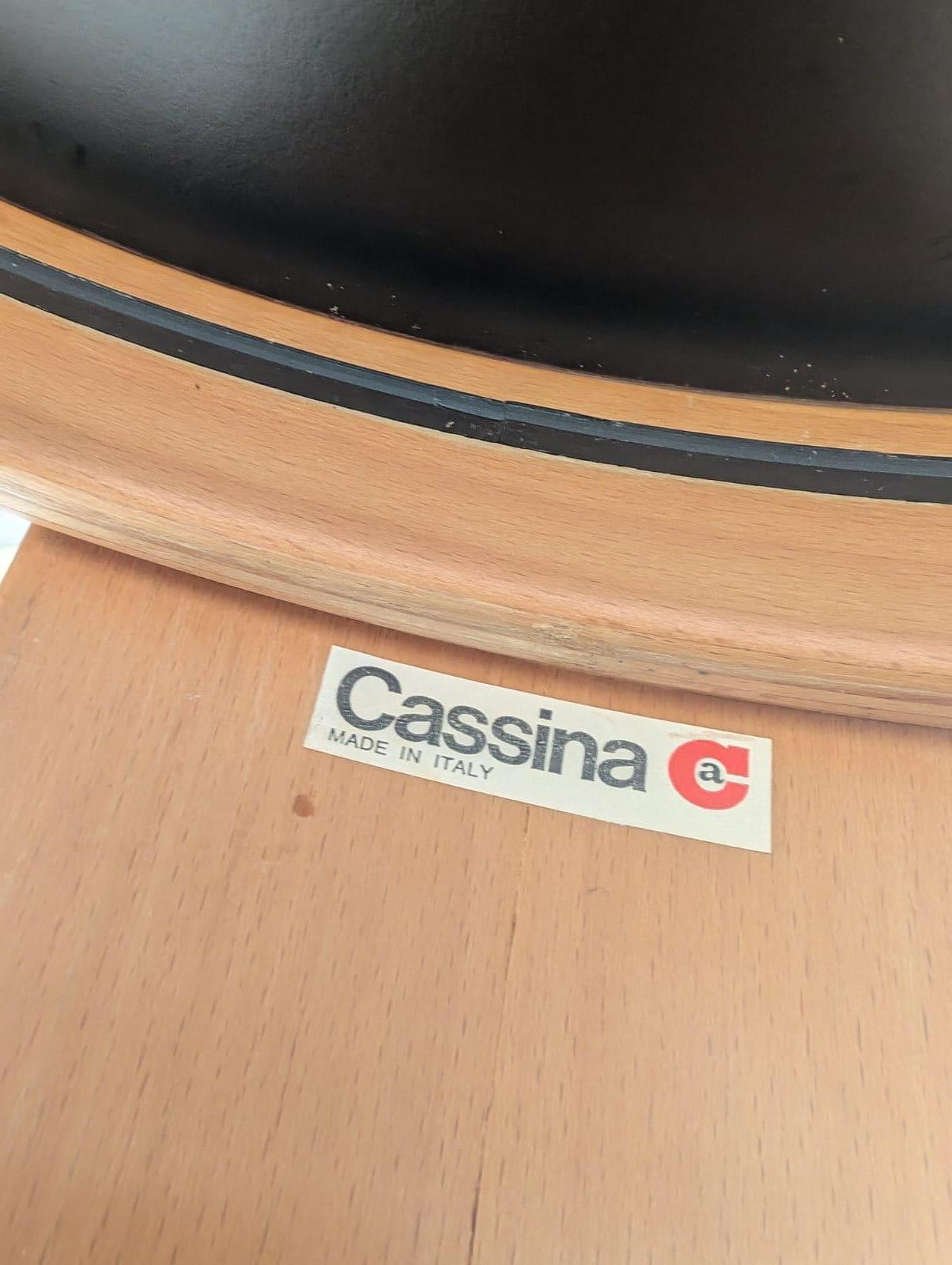 Set of 4 Nesting tables for living room spaces desgined by Gianfranco Frattini and produced by Cassina. The solid and robust table structure is made from durmast with its typical honey colour. Each table has 3 legs. The top of the tables is