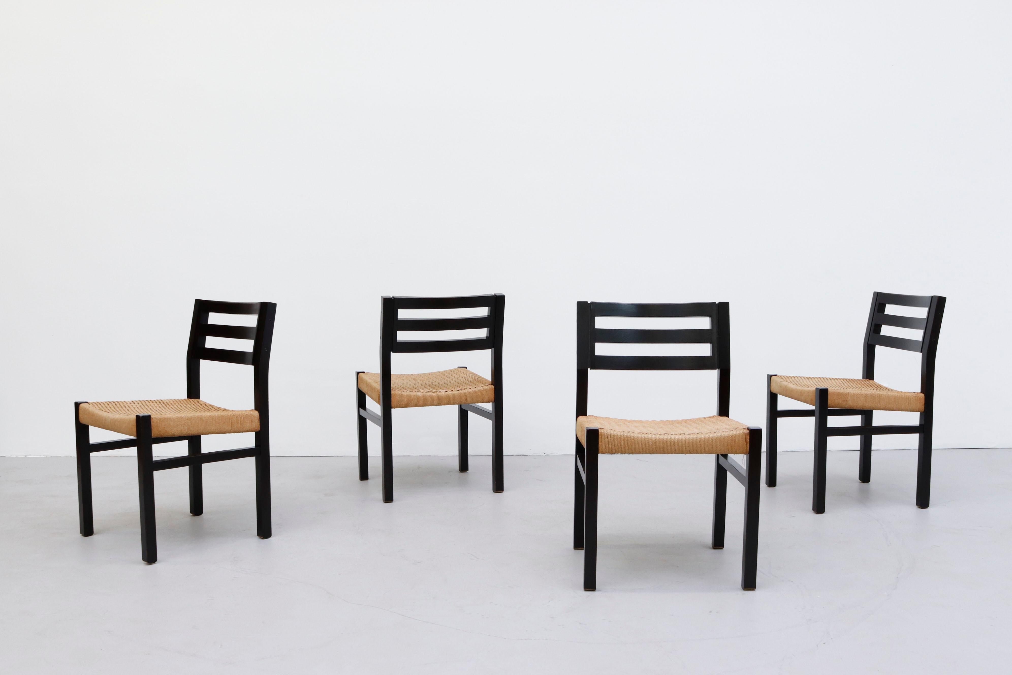 Set of 4 Niels Moller Dining Chairs with Black Stained Oak Frames and Woven Paper Cord Seats. Lightly Refinished with Some Visible Frame Wear and Discoloration to Seat. Set Price.