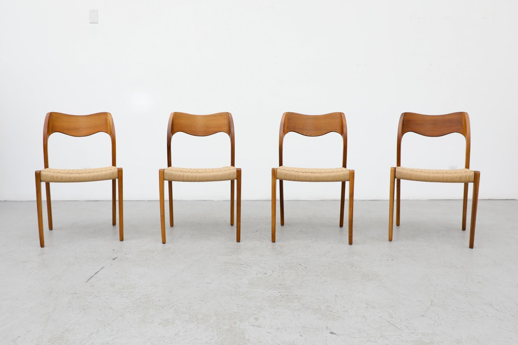 Set of 4 mid-century model 71 dining chairs with paper cord seating, designed by Niels Moller for J. L. Møllers Møbelfabrik. Originally designed in 1951. In original condition with visible wear consistent with their age and use.