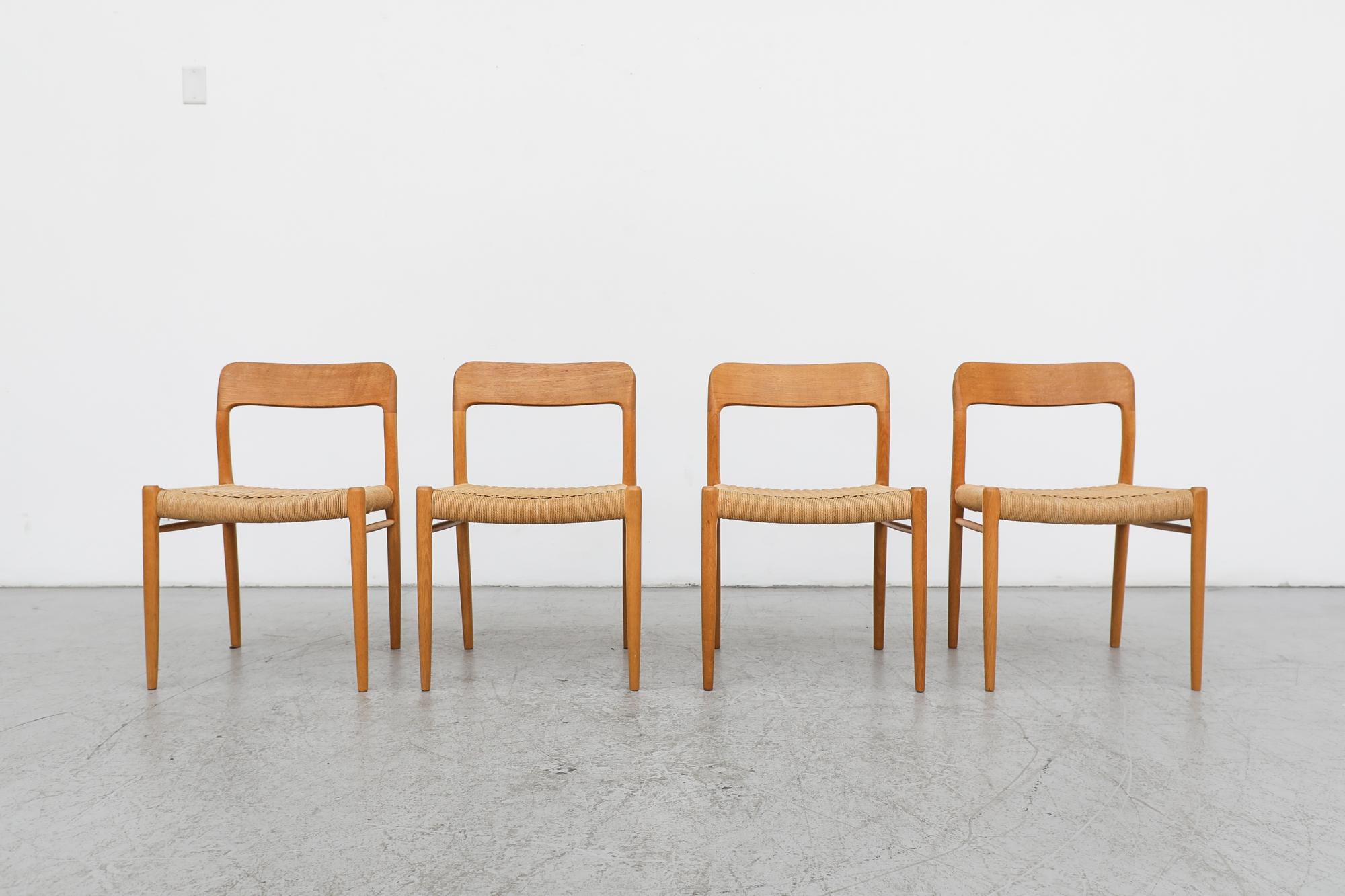 Mid-century set of 4 oak and paper cord side chairs designed in 1954 by Niels O. Møller for J.L. Møllers. Handsomely designed by the Danish designer, these 