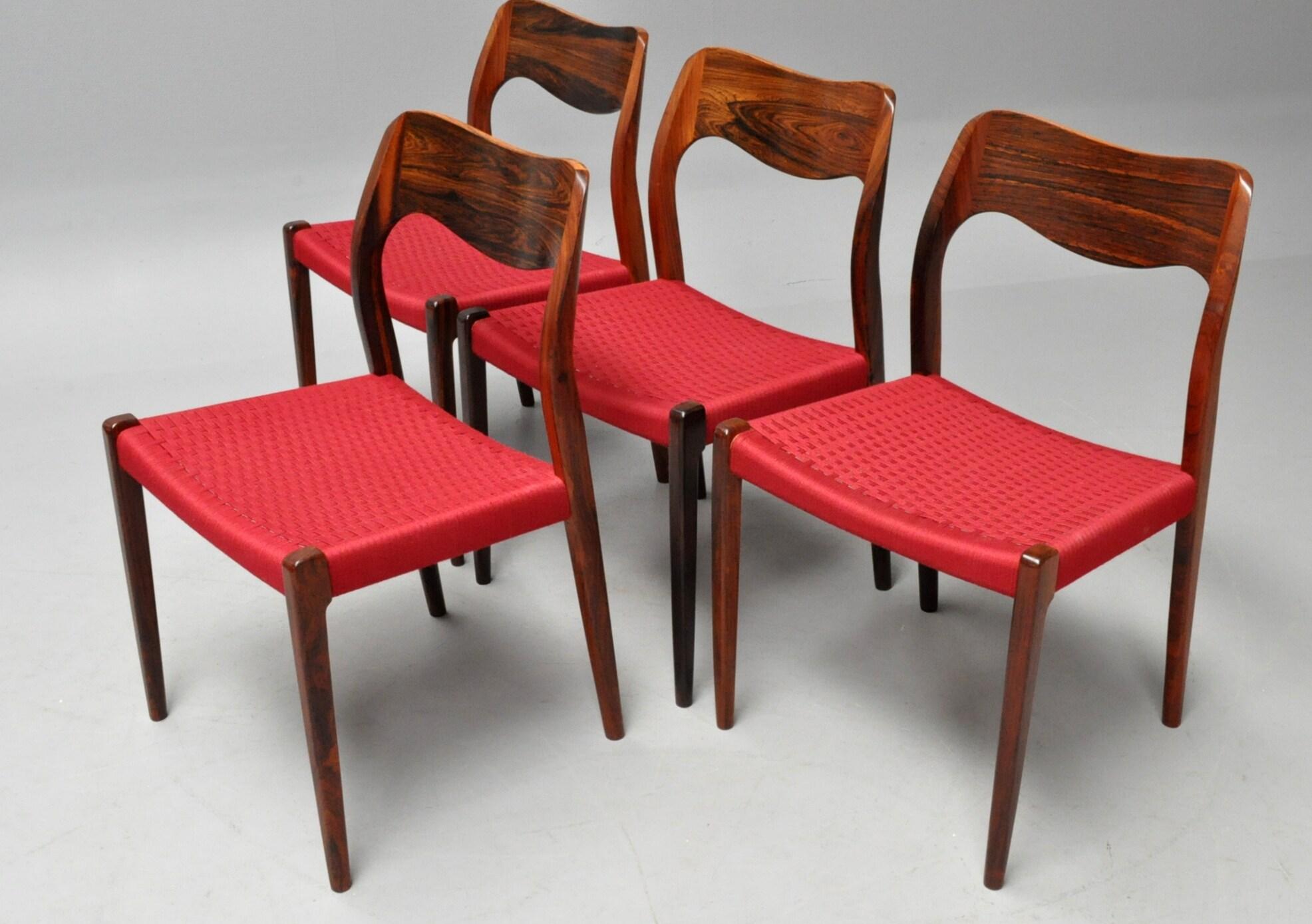 This set of Niel Otoo Moller's Model 71 chair was designed in 1952. Mosty assume that Niel Otto Moller designed this first chair produced by his workshop JL Moller but in fact, Niels Otto Moller commissioned Arne Hovmand Olsen to design this model.