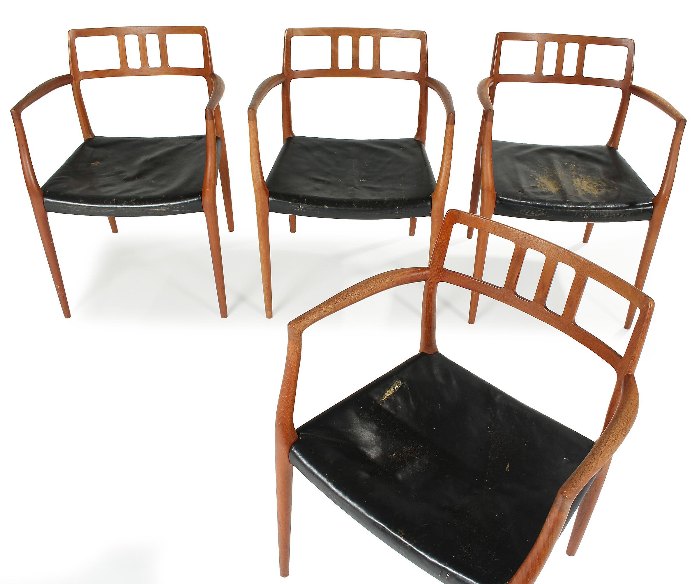 This set of four teak dining chairs by Niels Otto Moller. Round label dates these chairs as made between 1964 and 1969. Chairs require new black leather, which is included in listing price. Reupholstery in aniline black leather will take 3-4 weeks.