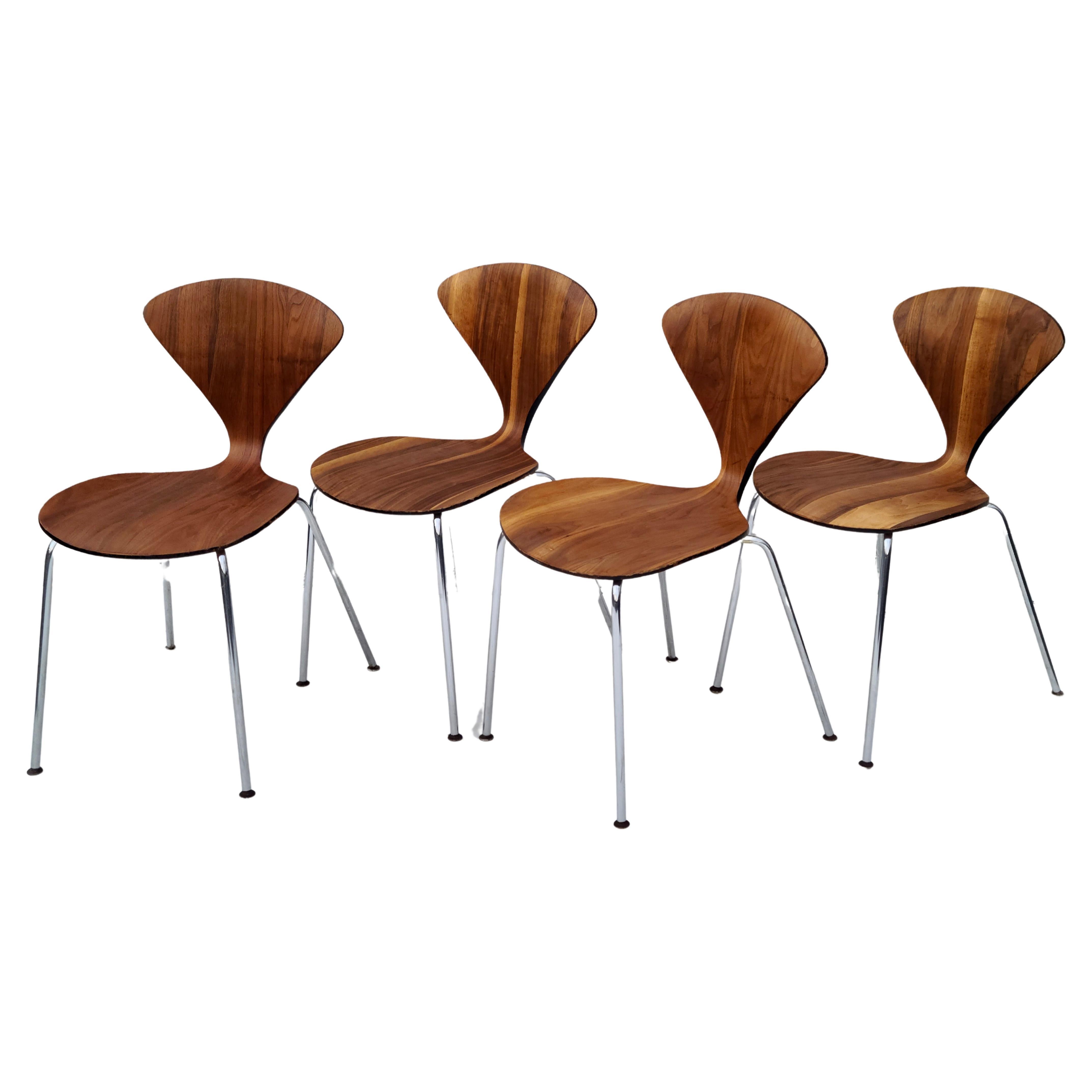 Please feel free to reach out for accurate shipping to your location.

Set of 4 Norman Cherner side chairs.
Walnut veneer on chrome bases.
These chairs have rare Directional labels.
Some light refinishing to refresh the grain, and 
preserve some