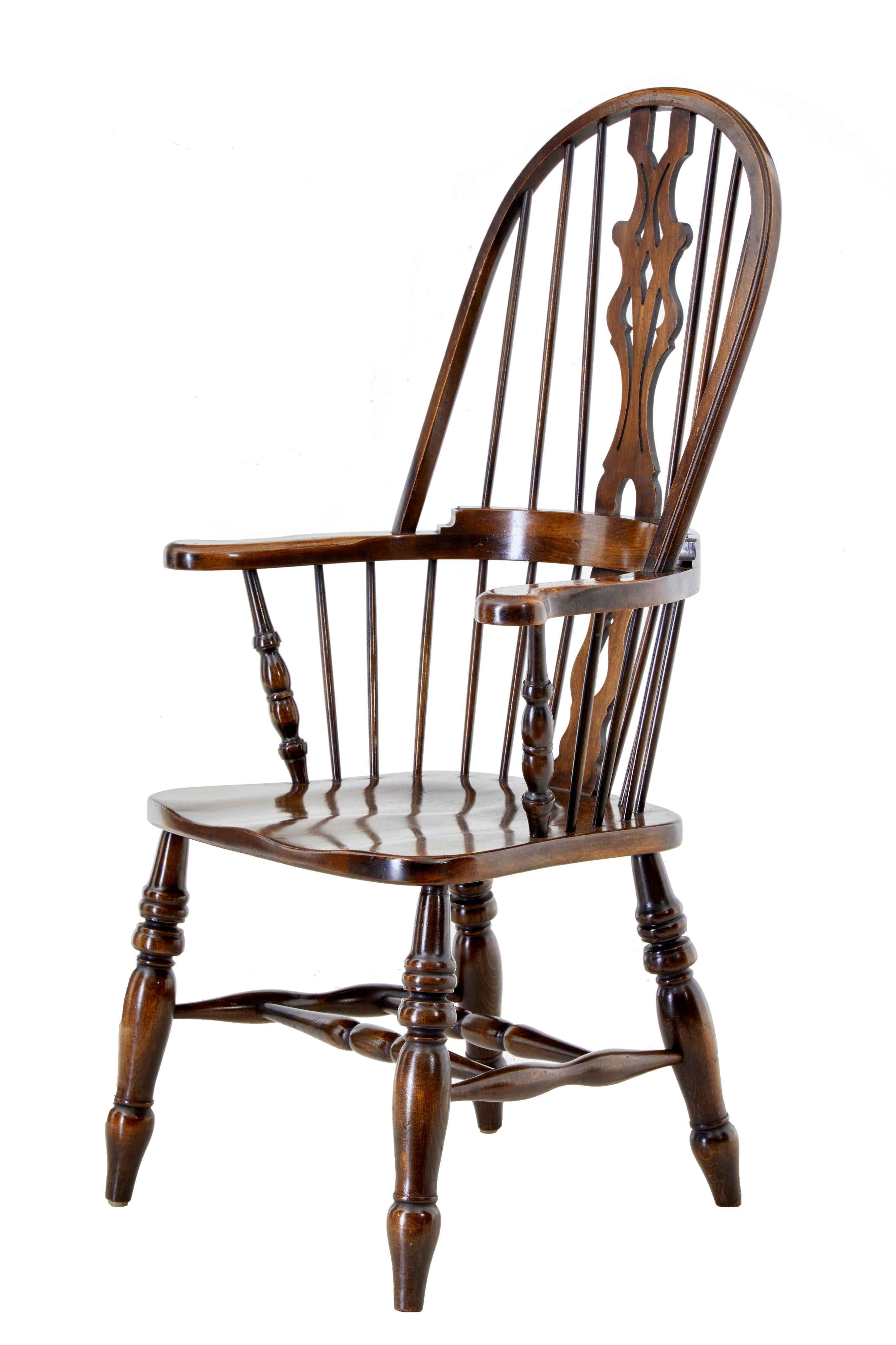 Set of 4 oak and elm Windsor armchairs by Bevan and Funnel, circa 1970.

Fine quality reproductions of a well known design by Bevan & funnel. Shaped back rests with turned spindles and fret backrest. Shepards crook shaped arm, standing on 4 turned