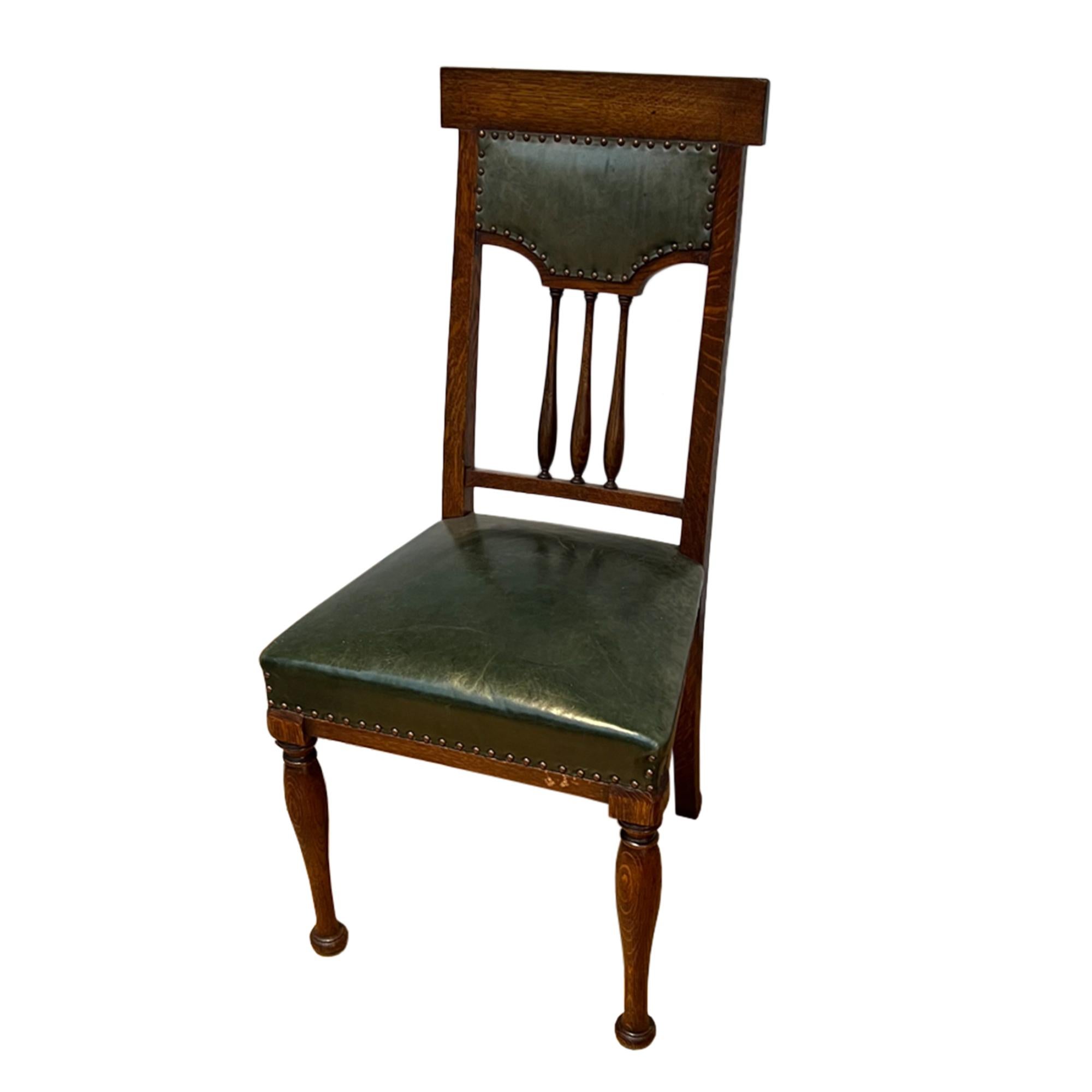 This lovely set of dining chairs are made from oak and leather with brass studs.

Made in the 1910s - a great example of British antiques in the Arts and Crafts style.