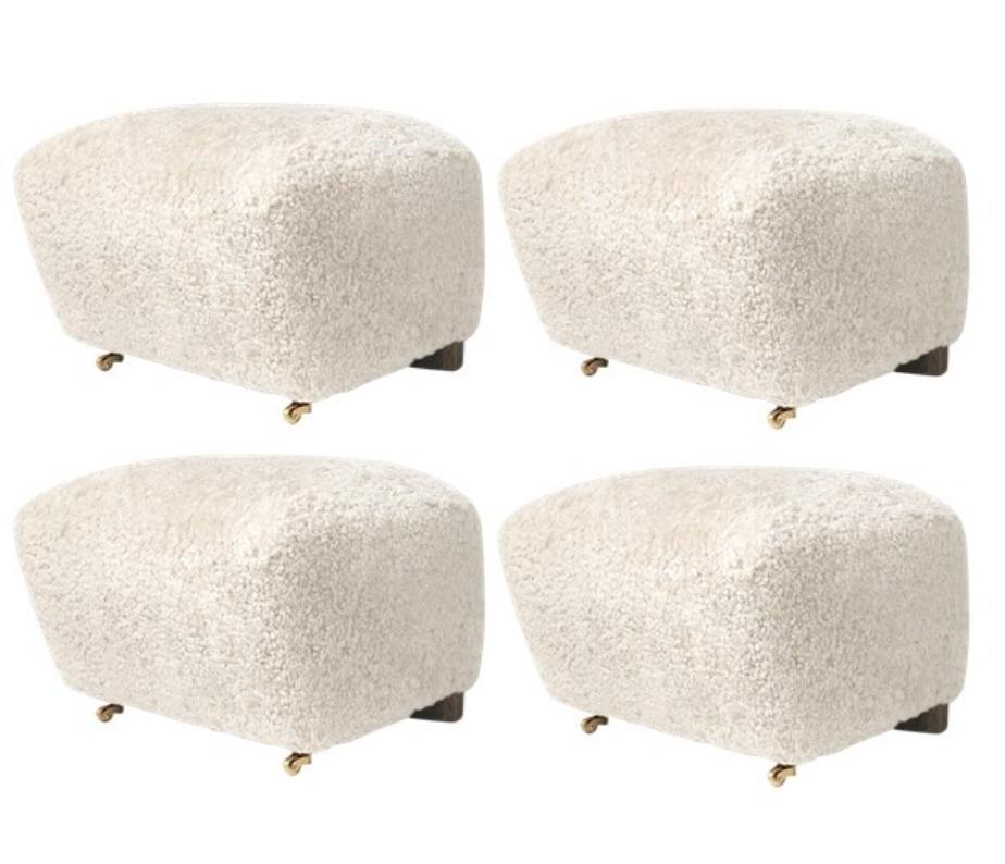 Set Of 4 off white smoked Oak Sheepskin the Tired Man footstools by Lassen
Dimensions: W 55 x D 53 x H 36 cm 
Materials: Sheepskin

Flemming Lassen designed the overstuffed easy chair, The Tired Man, for The Copenhagen Cabinetmakers’ Guild