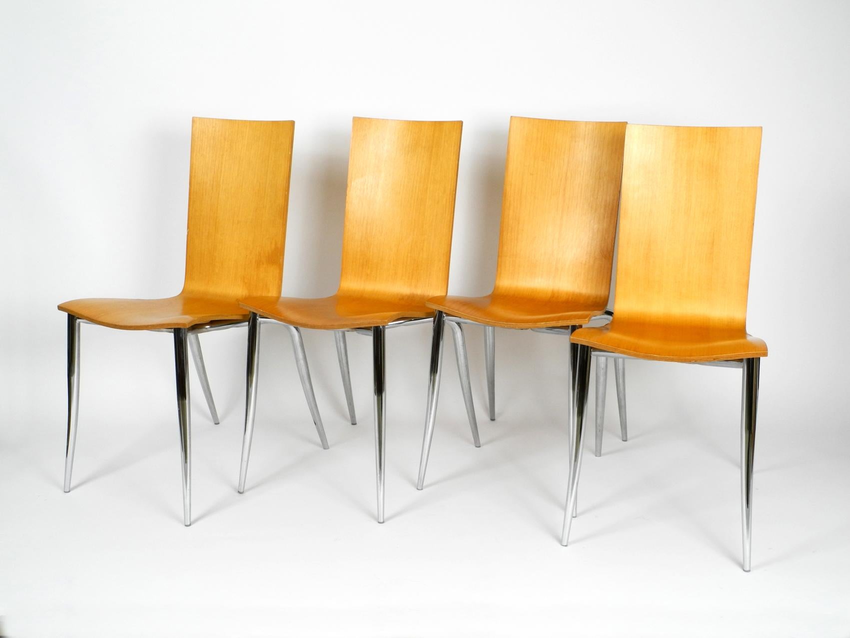 Set of 4 Olly Tango chairs from the 1990s. Design by Philippe Starck. Manufacturer Driade Aleph. Made in Italy. Elegant minimalist postmodern design. Seat made of thick molded plywood. Organically shaped metal legs chromed.
Massively built and very