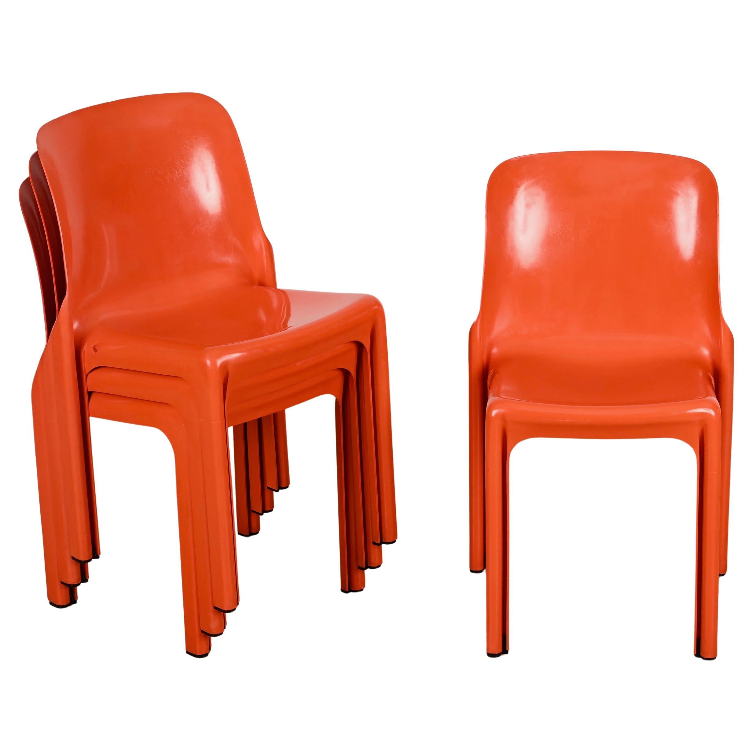 Wonderful set of 4 orange Selene chairs. These iconic chairs were designed by Vico Magistretti and produced by Artemide in Italy in 1969.

Fully original and in great vintage conditions, very rare in the vibrant orange version which embodies the