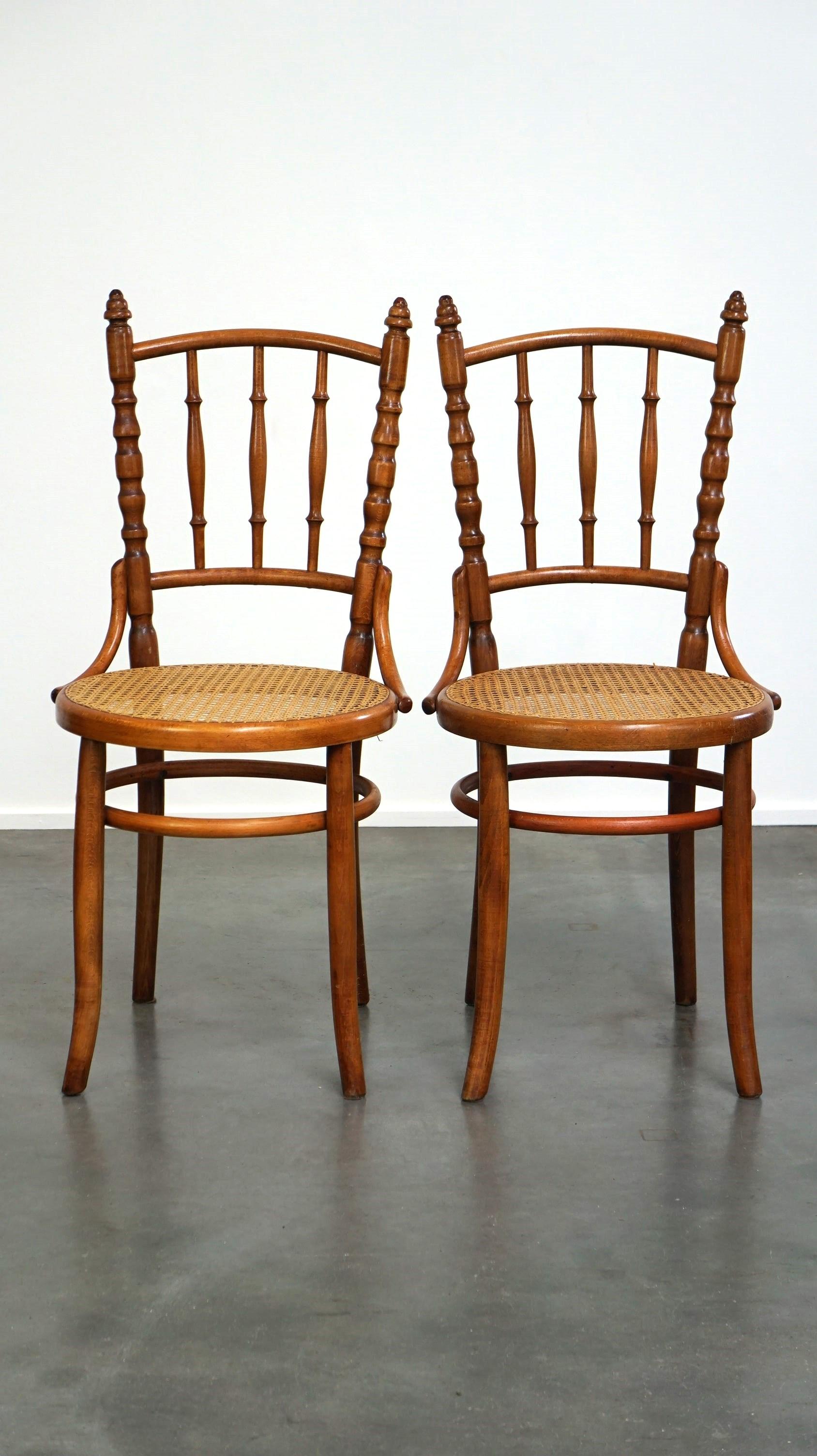 Available: Charming Set of 4 Original and Antique Thonet Bistro Chairs with a Fantastic Look
This set of four original antique Thonet bistro chairs, produced by Fischel, showcases elegant and classic design. Crafted from bent wood, these chairs