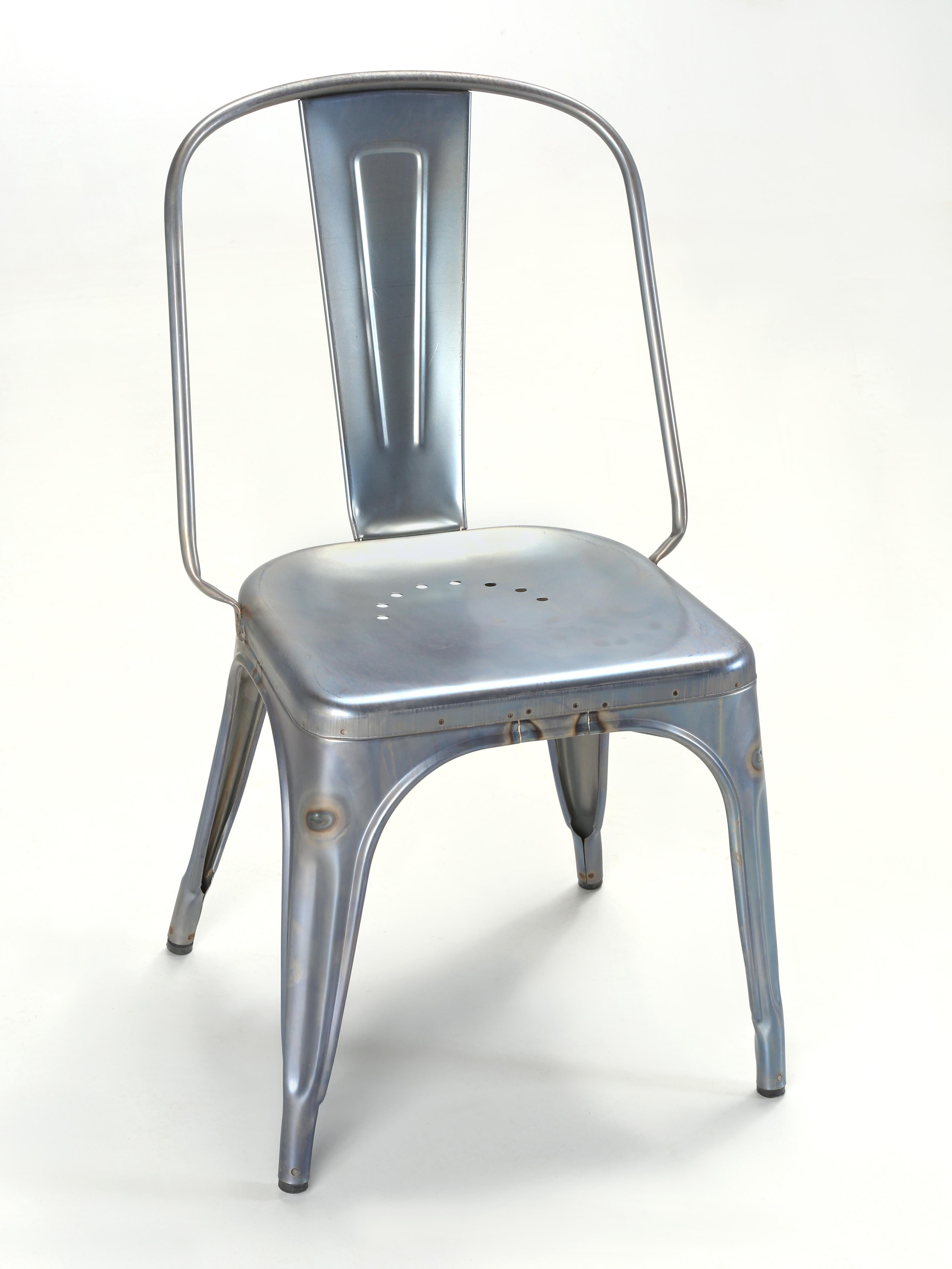 Genuine Made in France Tolix Steel Stacking Chairs that have been sitting in a Chicago warehouse for roughly 10-years. There are currently about (40) matching Tolix Side Chairs and a couple of Counter Stools in the same blue-wash finish. In total,