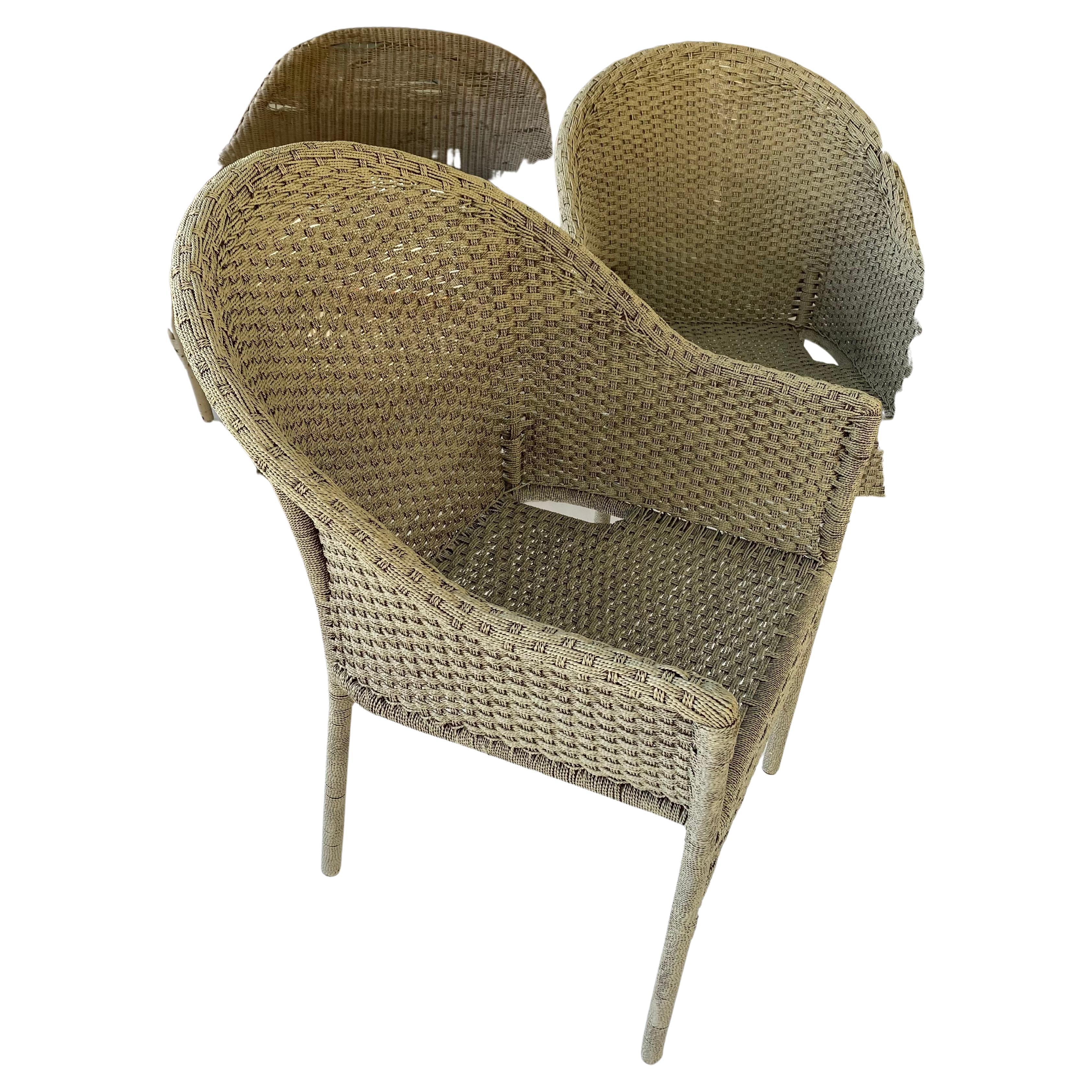 Set 4 outdoor woven armchairs crafted from a composite material. The chairs with the curved back gives it added comfort.  Wear is  consistent with age and exposure. Great for indoor or outdoor, patio or porch, garden dining or lounging.
These chairs