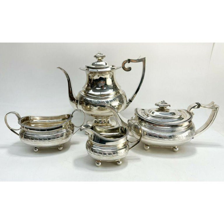 Set of 4 Peter Ann William Bateman London sterling silver serving pieces, 1815

Peter, Ann & William Bateman London sterling silver tea and coffee serving pieces, 1815. Hand chased leaves and circles to the circular band and a gadroon rim. Gold
